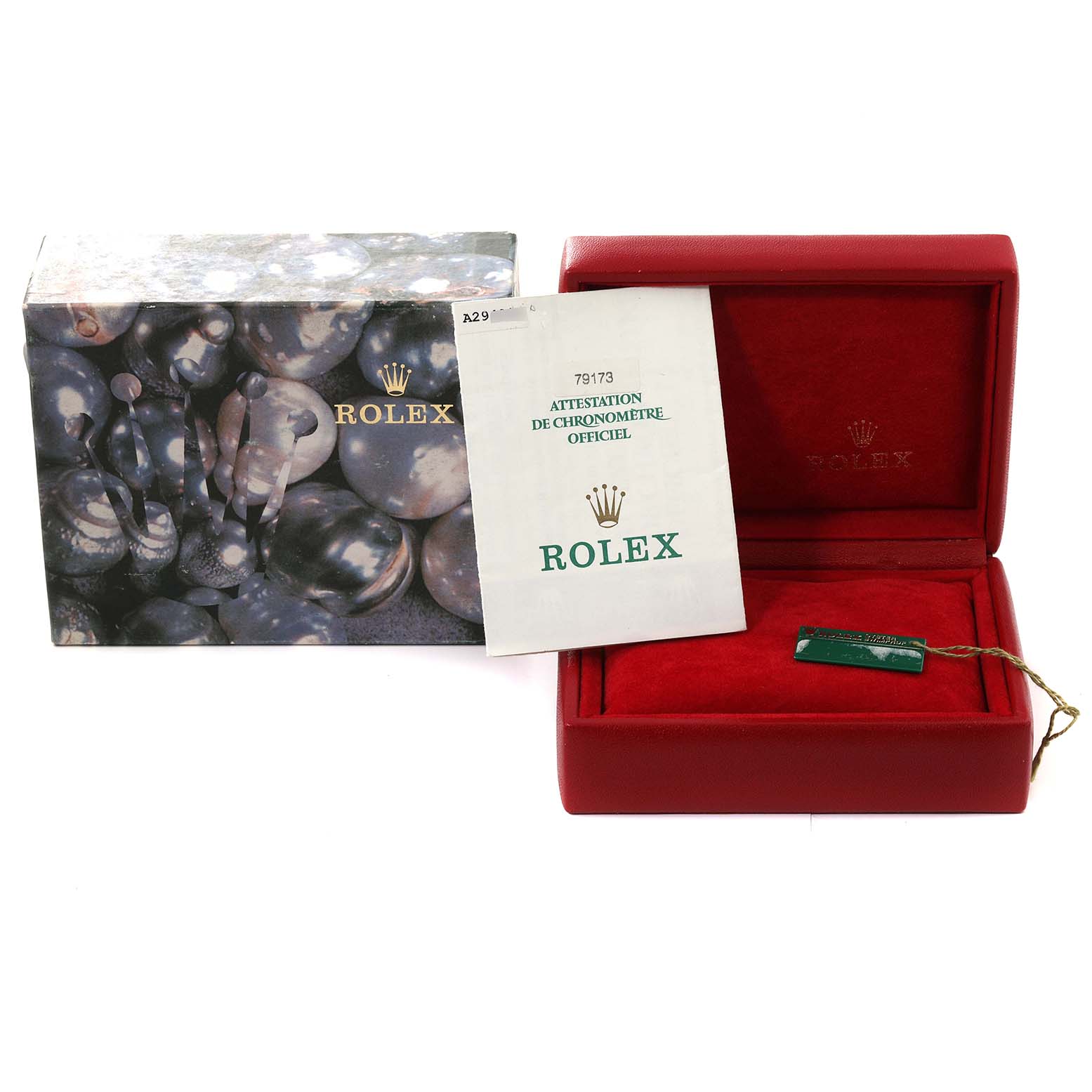 The image shows the packaging, warranty booklet, and tag accessory of a Rolex Datejust 79173 Women's Steel and Gold (two tone) Green Dial 79173 Women's Steel and Gold (two tone) Green Dial watch.