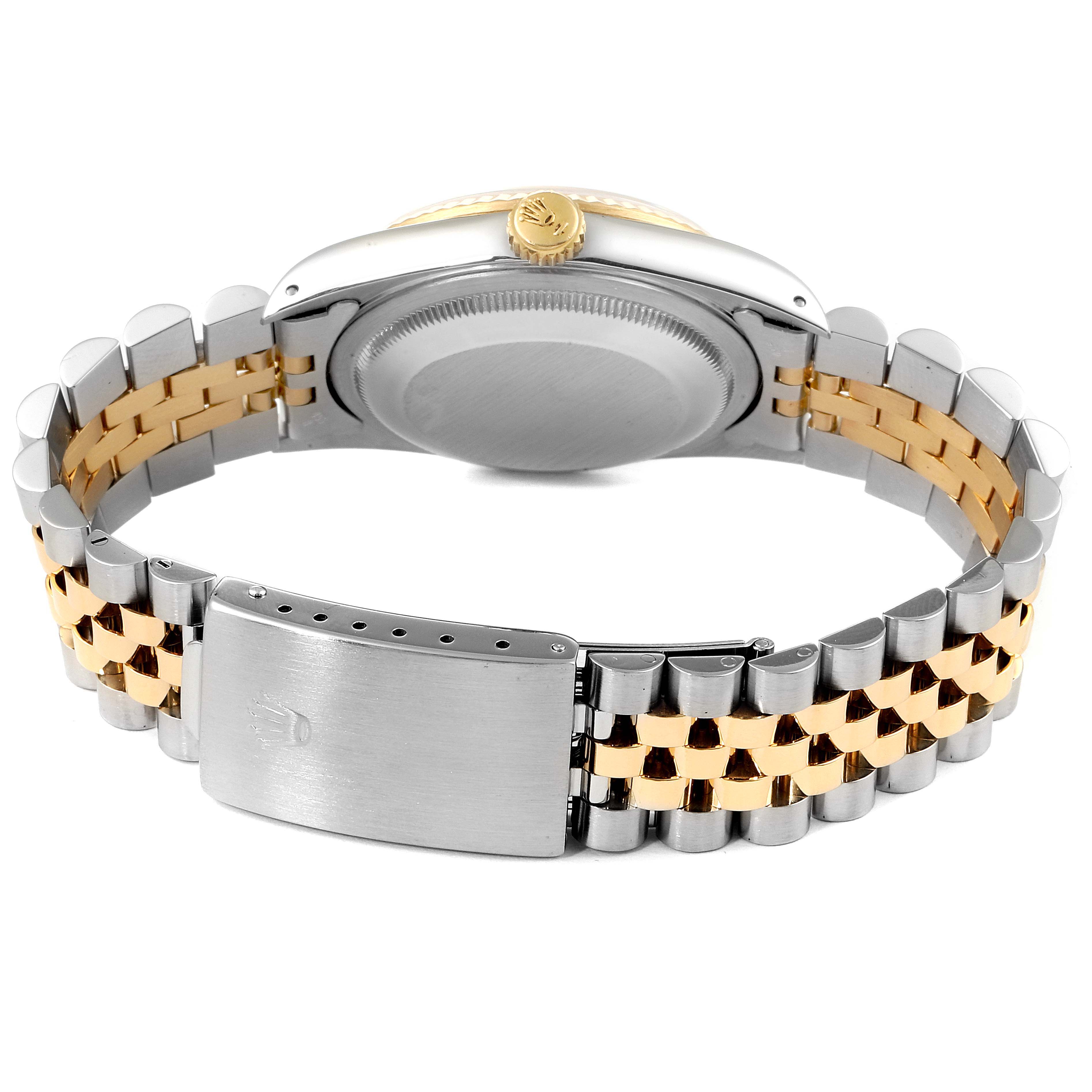 The image shows the back view of a Rolex Datejust 16233 Men
s Steel and Gold (two tone) Beige Dial 16233 Men
s Steel and Gold (two tone) Beige Dial watch, highlighting the case back and two-tone bracelet with clasp.