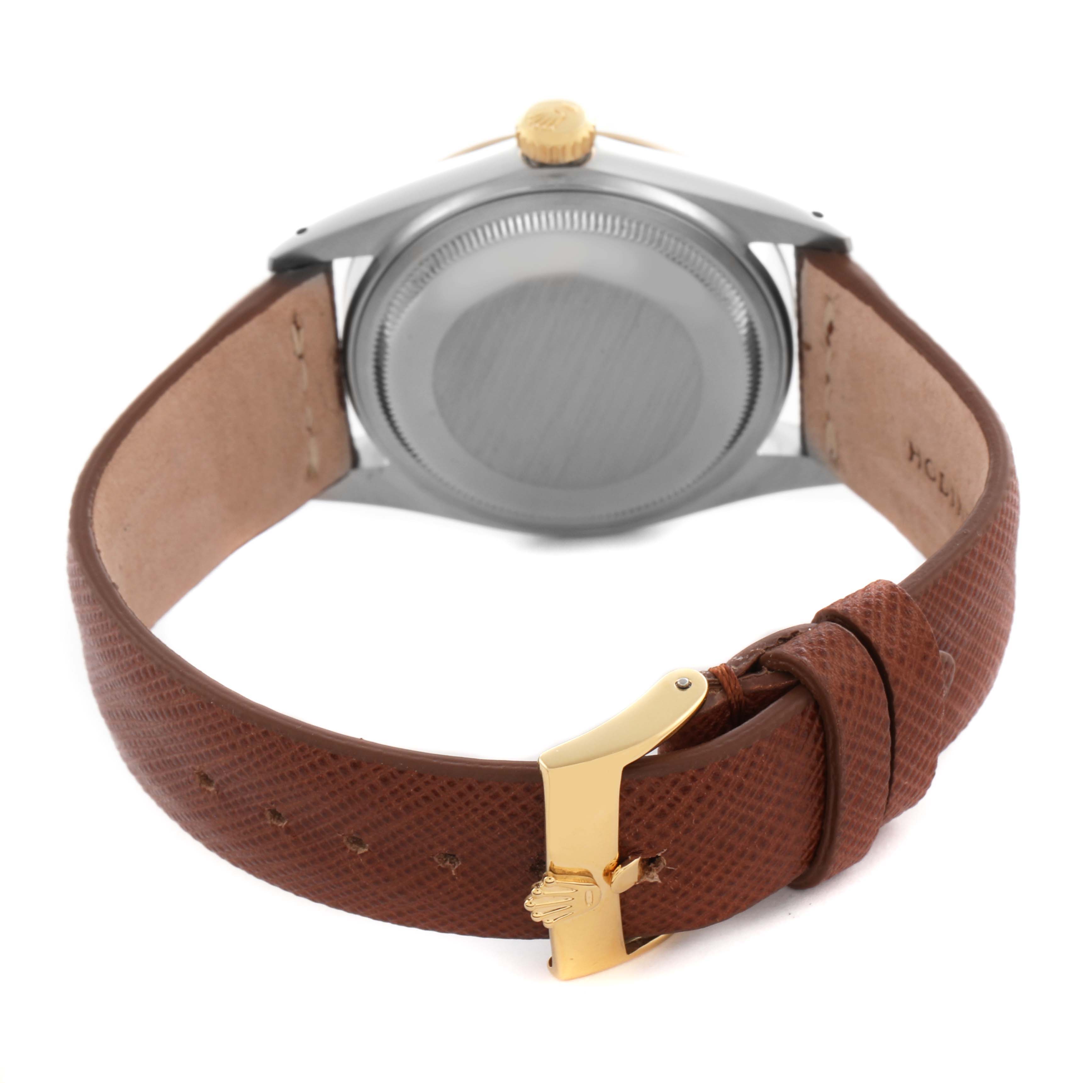 The image shows the back and side of a Rolex Vintage Collection 16013 Men's Steel and Gold (two tone) Champagne Dial 16013 Men's Steel and Gold (two tone) Champagne Dial watch with a brown leather strap and gold buckle.