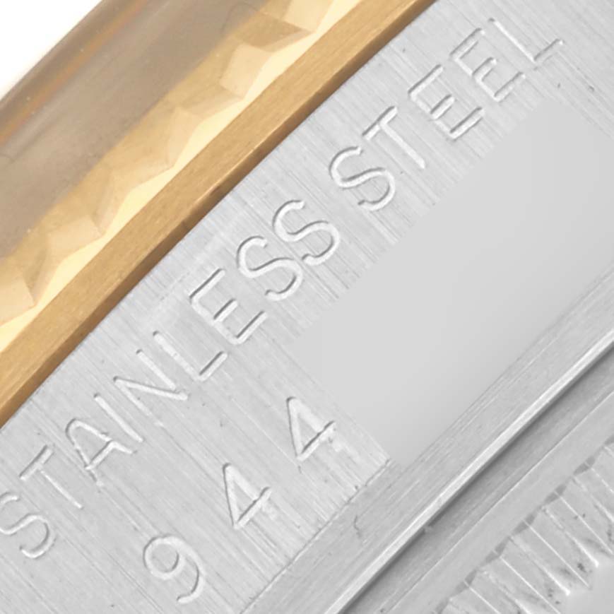 The image shows a close-up of the case side of a Rolex Vintage Collection 16013 Men's Steel and Gold (two tone) Champagne Dial 16013 Men's Steel and Gold (two tone) Champagne Dial watch, highlighting the stainless steel and gold elements.