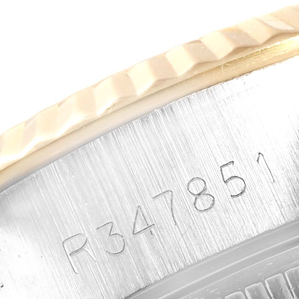 This image shows a close-up of the serial number engraving on the side of a Rolex Datejust 69173 Women
s Stainless Steel White Dial 69173 Women
s Stainless Steel White Dial watch case.