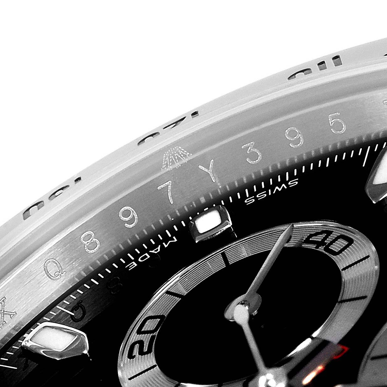 This close-up image of a Rolex Daytona 116520 Men's Stainless Steel Black Dial 116520 Men's Stainless Steel Black Dial watch shows part of the bezel and subdials.