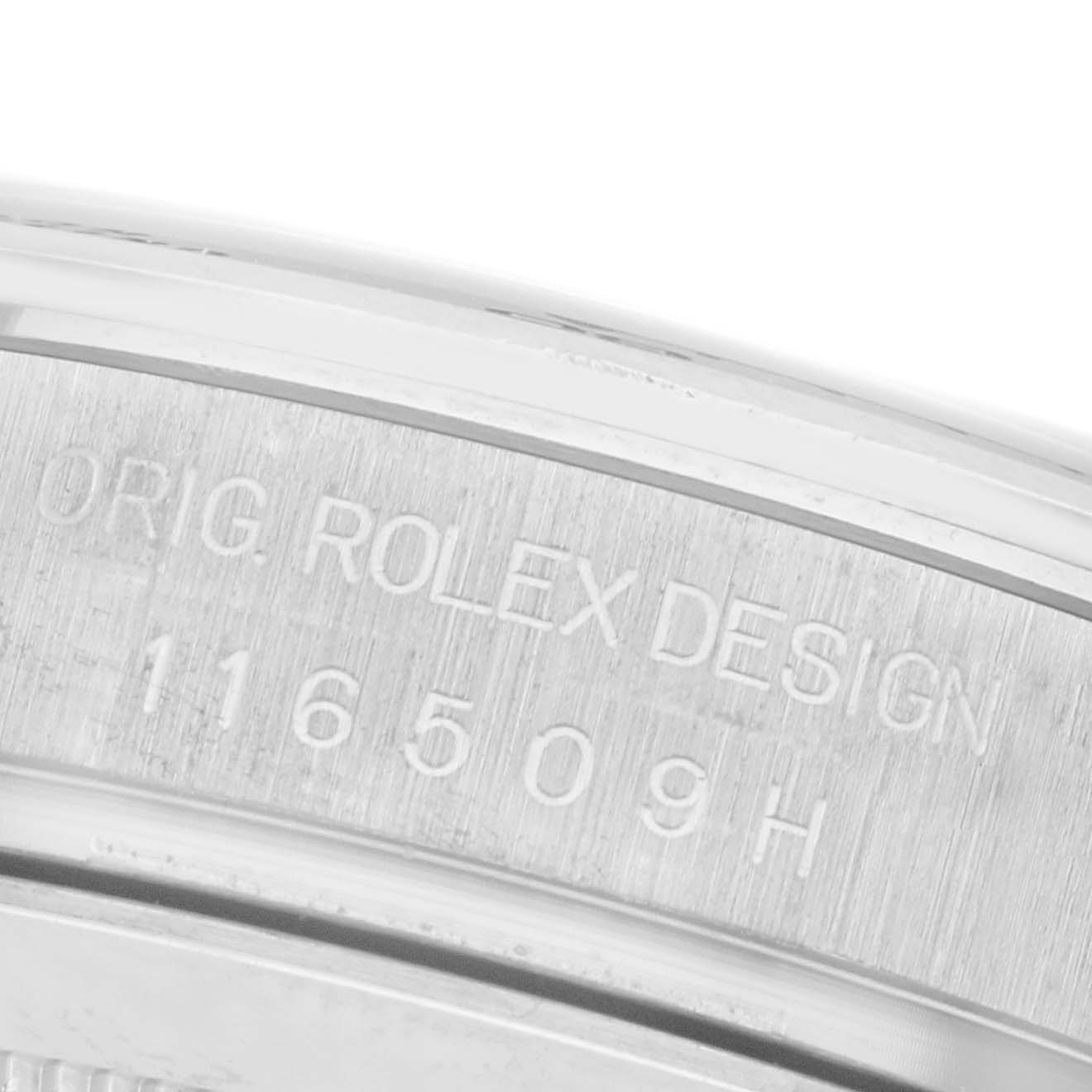 The image shows a close-up of the Rolex Daytona 116509 Men's White Gold Blue Dial 116509 Men's White Gold Blue Dial case side, focusing on the engraved serial number and "ORIG ROLEX DESIGN."