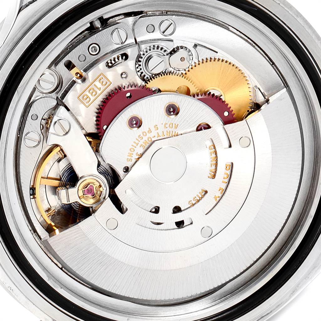 The image shows a close-up view of the intricate mechanical movement inside the Rolex Explorer 16570 Men
s Stainless Steel Black Dial 16570 Men
s Stainless Steel Black Dial watch.