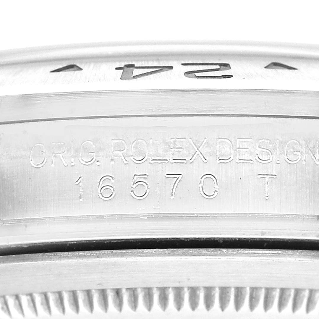 The image shows the side view of the bezel and case with engravings of the Rolex Explorer 16570 Men's Stainless Steel White Dial model.