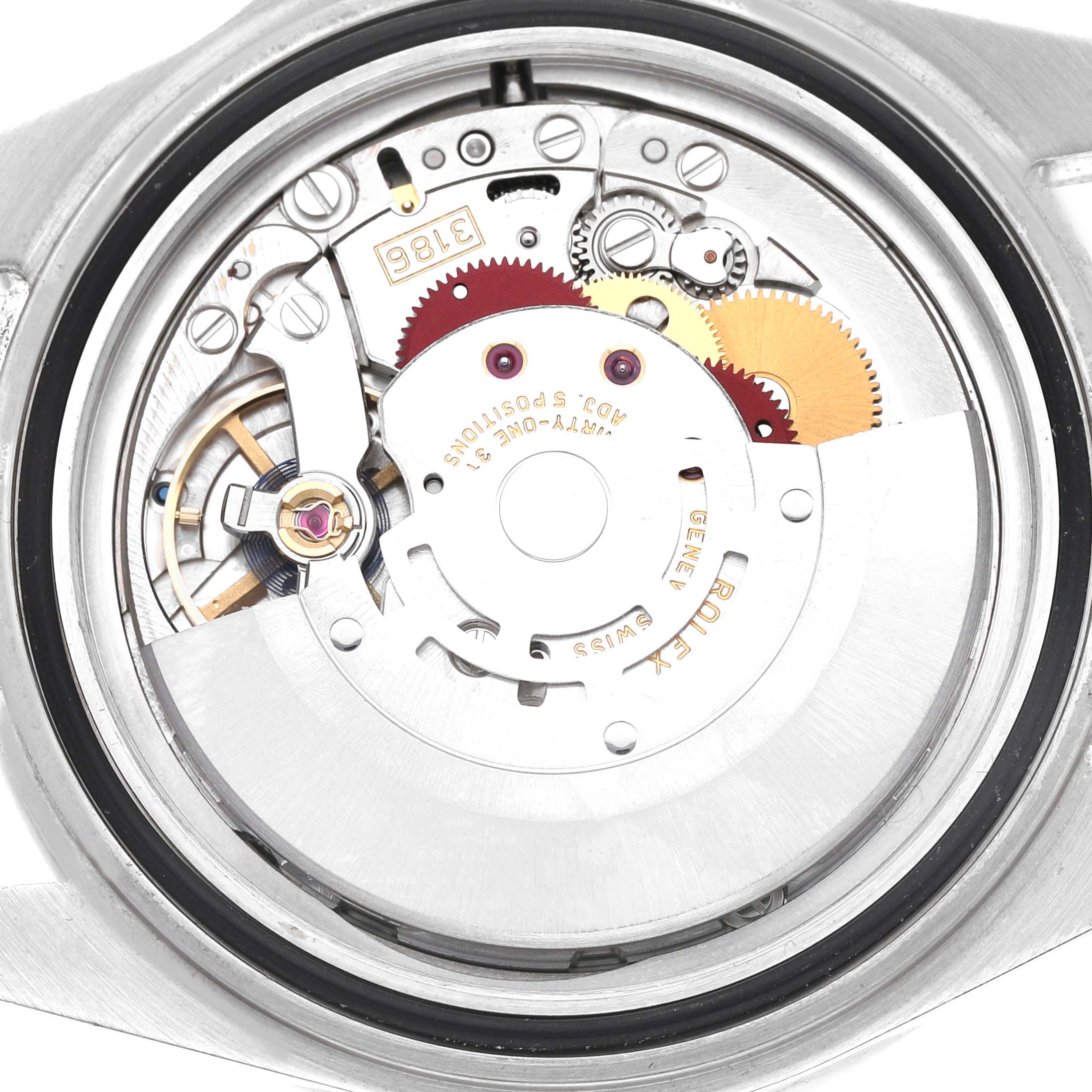 The image shows the movement of a Rolex Explorer 16570 Men's Stainless Steel White Dial watch from the back, highlighting the gears and internal mechanisms.