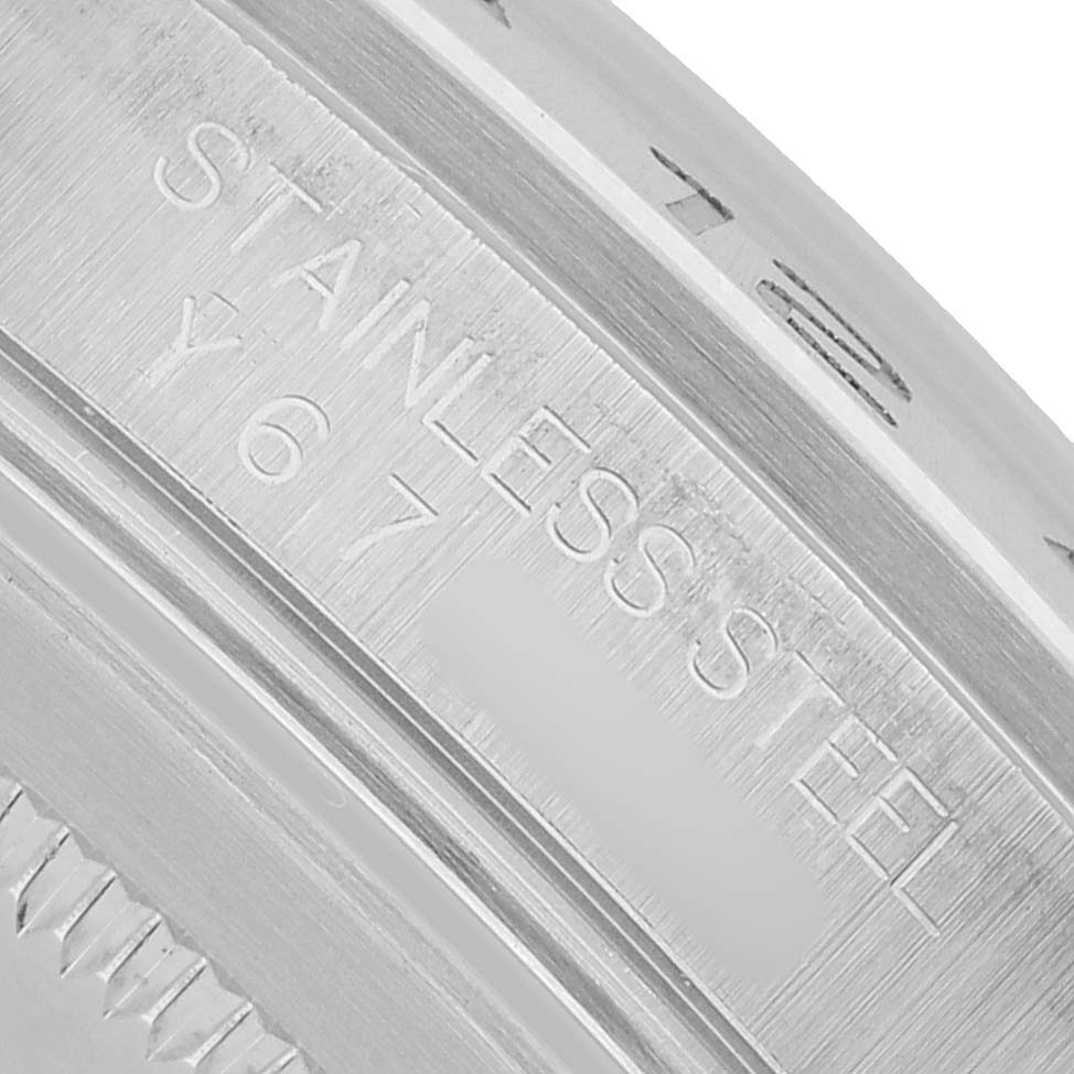 The image shows a close-up of the stainless steel rear case of a Rolex Explorer 16570 Men's Stainless Steel White Dial, highlighting the engraved markings.