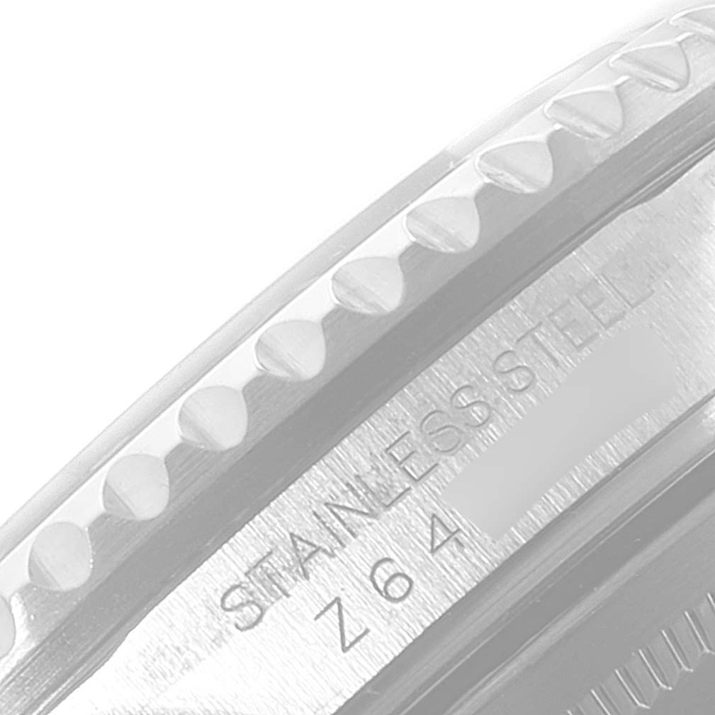 This close-up image shows the stainless steel bezel and the edge of the case of the Rolex GMT-Master 16710 Men's Stainless Steel Black Dial 16710 Men's Stainless Steel Black Dial watch.