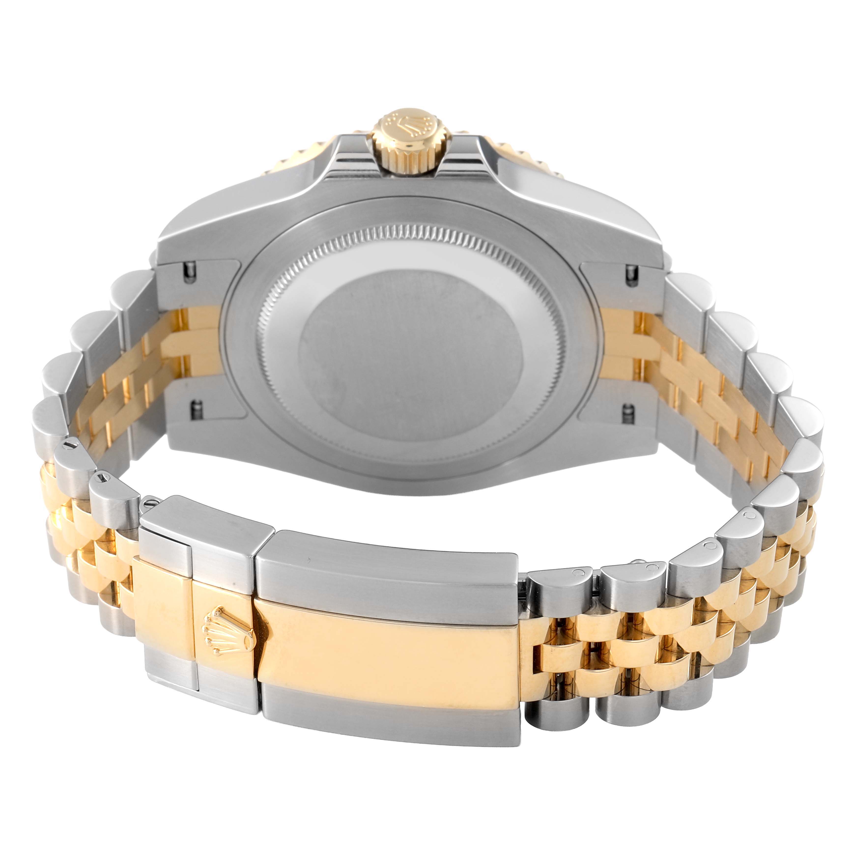 The image shows the back of a Rolex GMT-Master 126713GRNR Men's Stainless Steel Black Dial watch, focusing on the case back and the clasp of the bracelet.