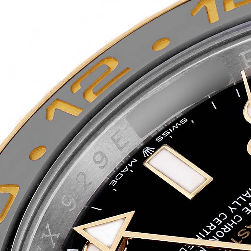 The image shows a close-up of the bezel and dial of the Rolex GMT-Master 126713GRNR Men's Stainless Steel Black Dial, highlighting the hour markers and part of the bezel numerals.