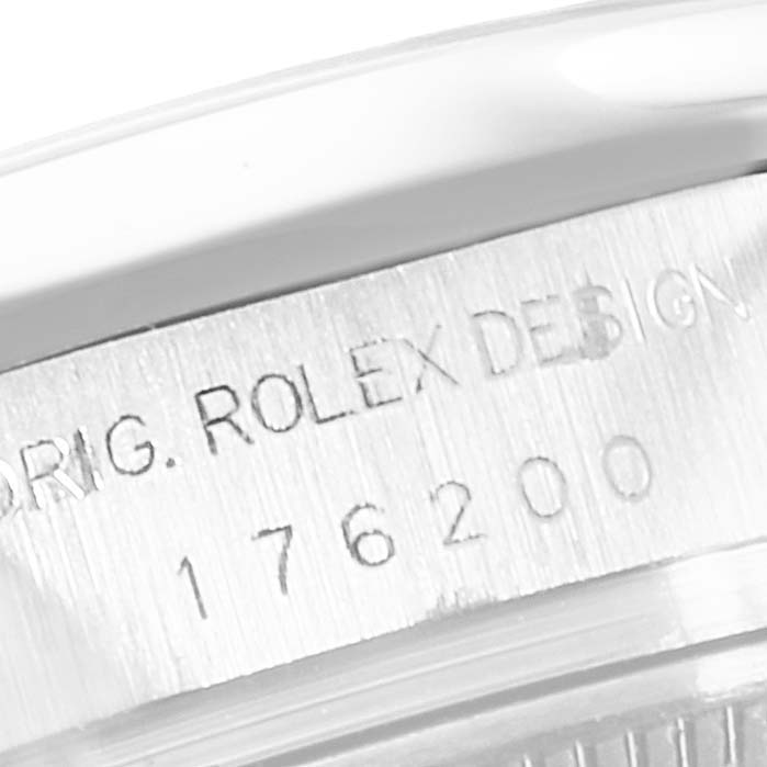 This image shows a close-up of the engraving on the side of a Rolex Oyster Perpetual 176200 Women's Stainless Steel Black Dial 176200 Women's Stainless Steel Black Dial watch case.