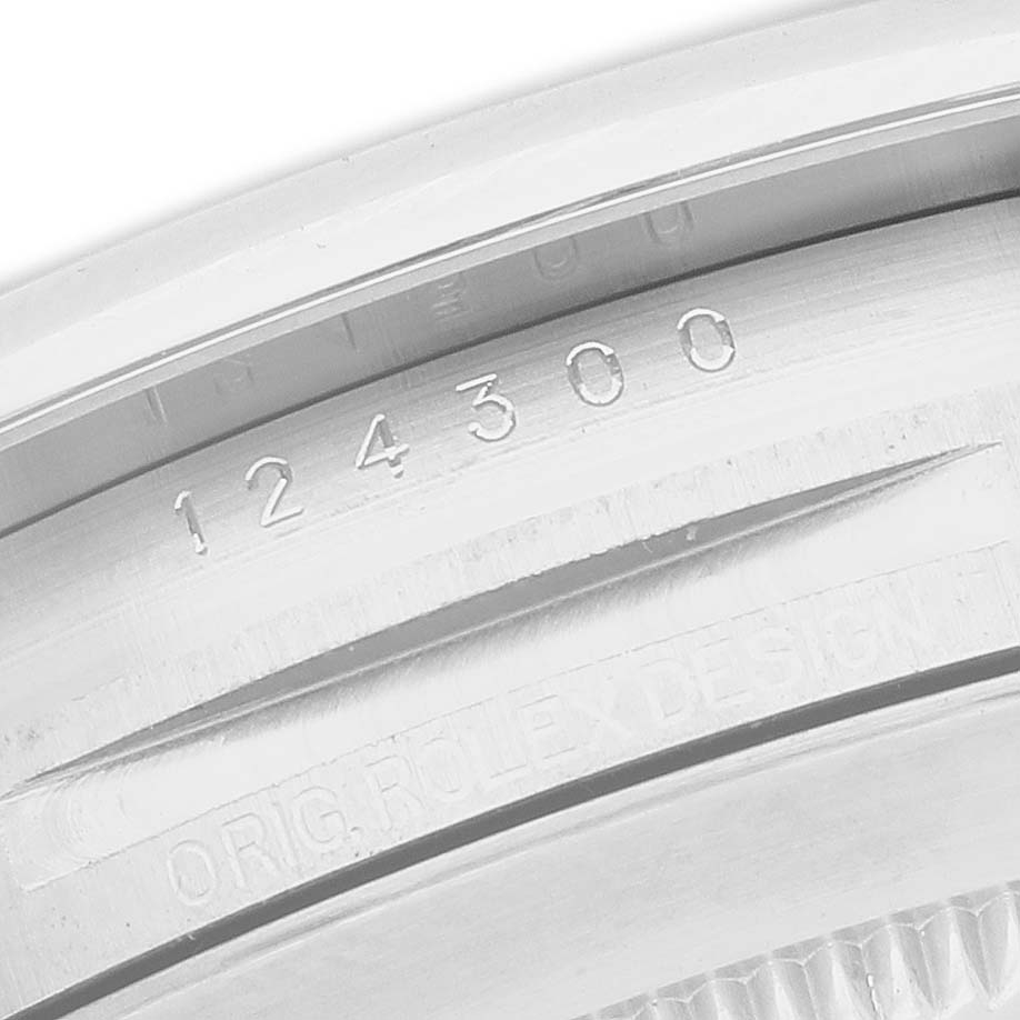 The image shows a close-up of the case edge and engraving of a Rolex Oyster Perpetual 7594Z726 Men's Stainless Steel Black Dial watch, focusing on the model number.