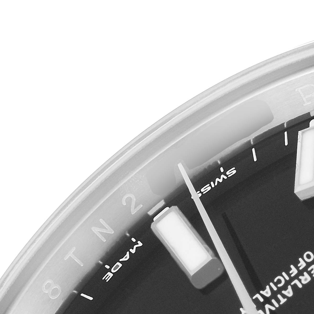This image shows a close-up of the dial, hour markers, and minute hand of a Rolex Oyster Perpetual 114200 Men's Stainless Steel Black Dial 114200 Men's Stainless Steel Black Dial watch at an oblique angle.