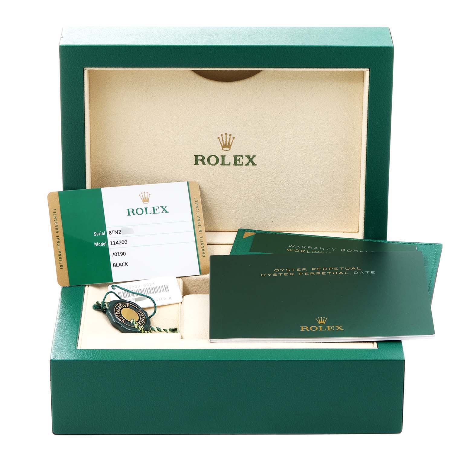 This image shows the packaging and documentation for the Rolex Oyster Perpetual 114200 Men's Stainless Steel Black Dial 114200 Men's Stainless Steel Black Dial model, including warranty cards and booklets.