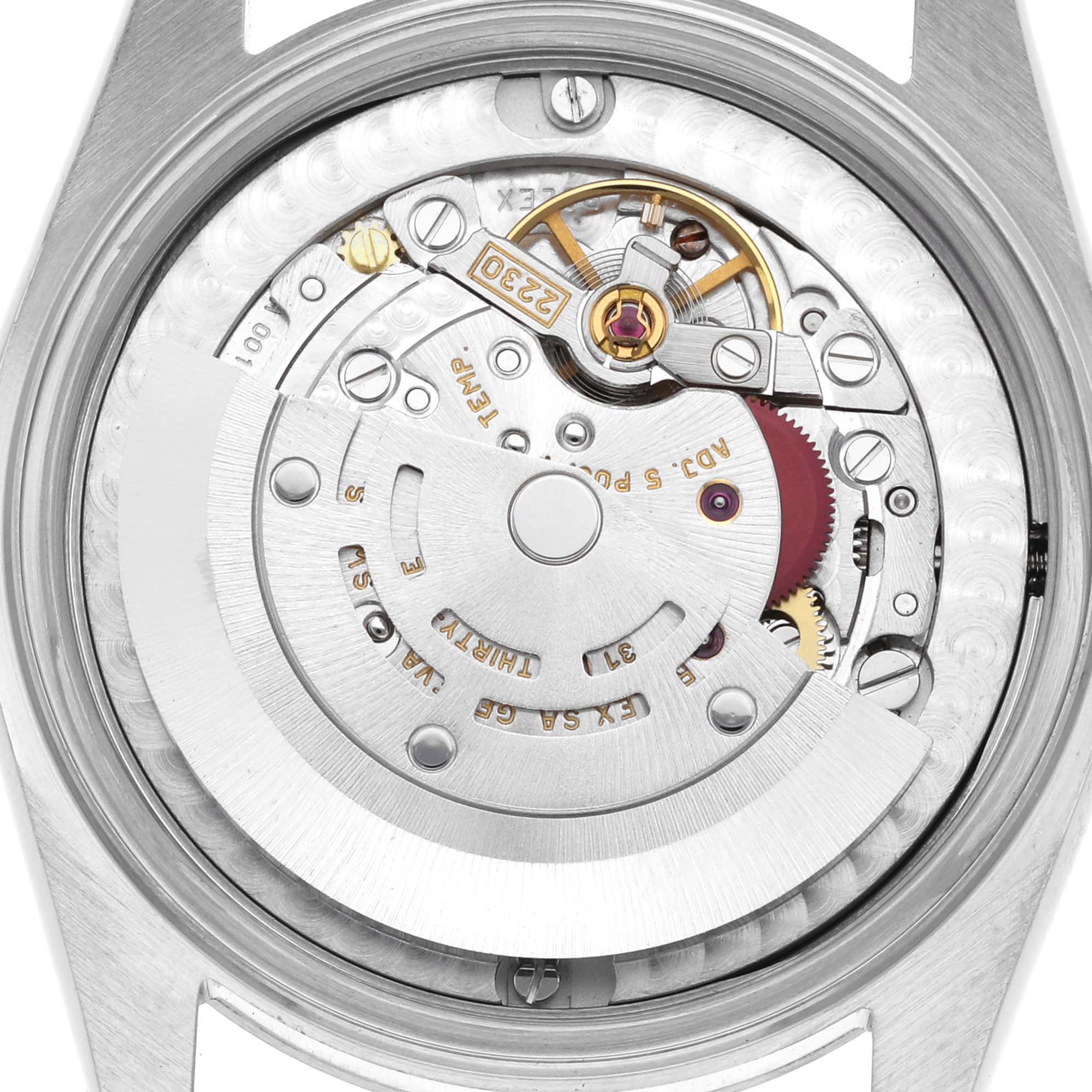 This image shows a close-up view of the Rolex Mid-Size 77080 Women
s Stainless Steel Silver Dial 77080 Women
s Stainless Steel Silver Dial watch
s movement and internal mechanism.