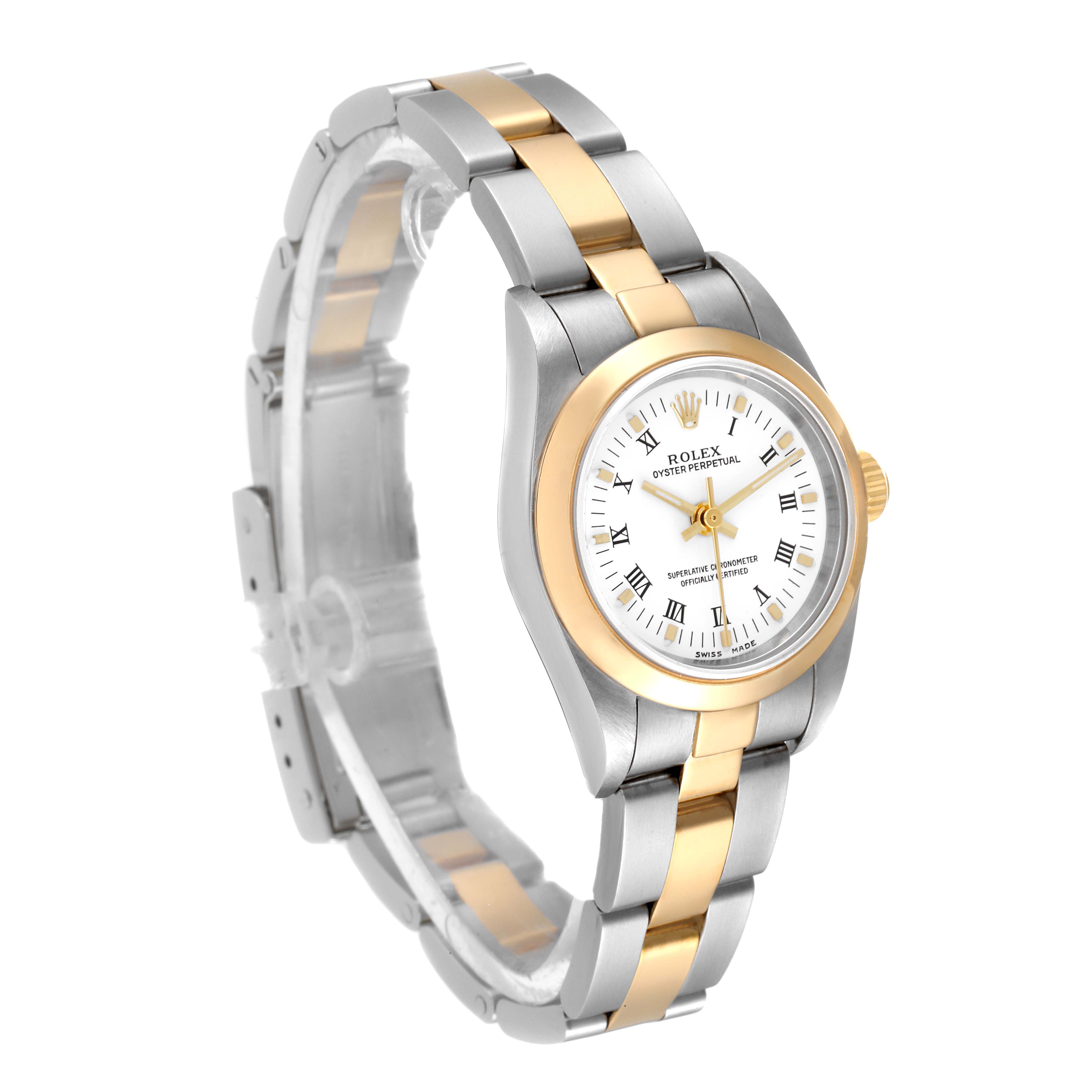 The image shows a side angled view of a Rolex Oyster Perpetual 76183 Women's Steel and Gold (two tone) White Dial 76183 Women's Steel and Gold (two tone) White Dial watch, highlighting its two-tone bracelet and gold bezel.