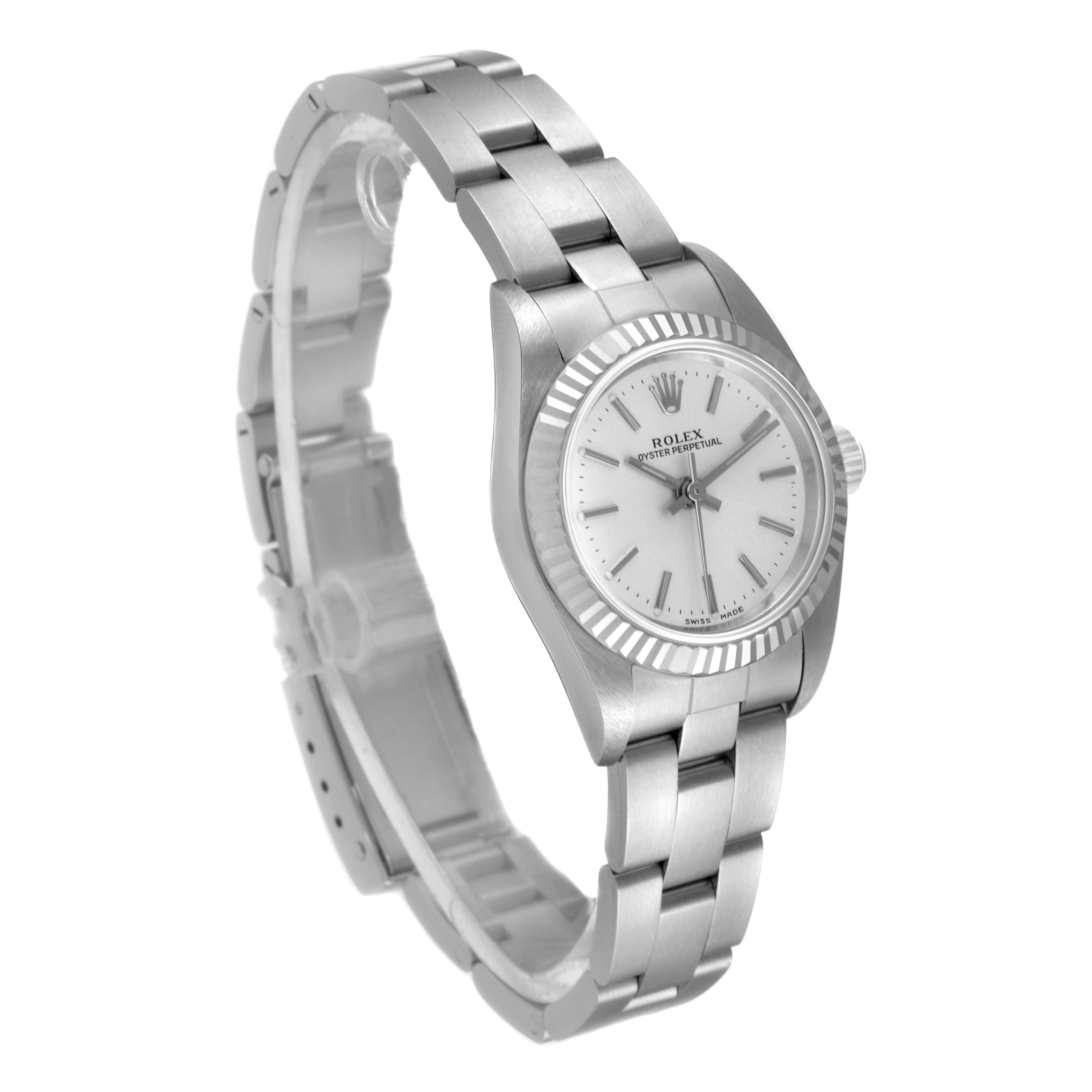 The image shows a side angle of a Rolex Oyster Perpetual 76094 Women
s Stainless Steel Silver Dial 76094 Women
s Stainless Steel Silver Dial watch, highlighting its bracelet and dial.