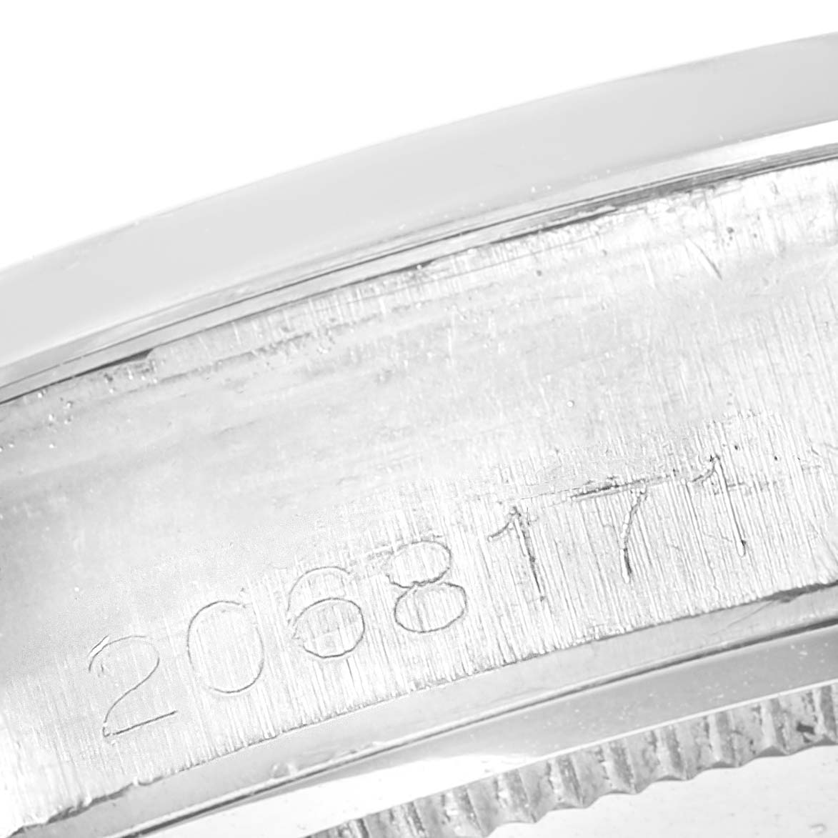This image shows the side view of the serial number engraved on the case of a Rolex Vintage Collection 6694 Men's Stainless Steel Champagne Dial 6694 Men's Stainless Steel Champagne Dial model watch.