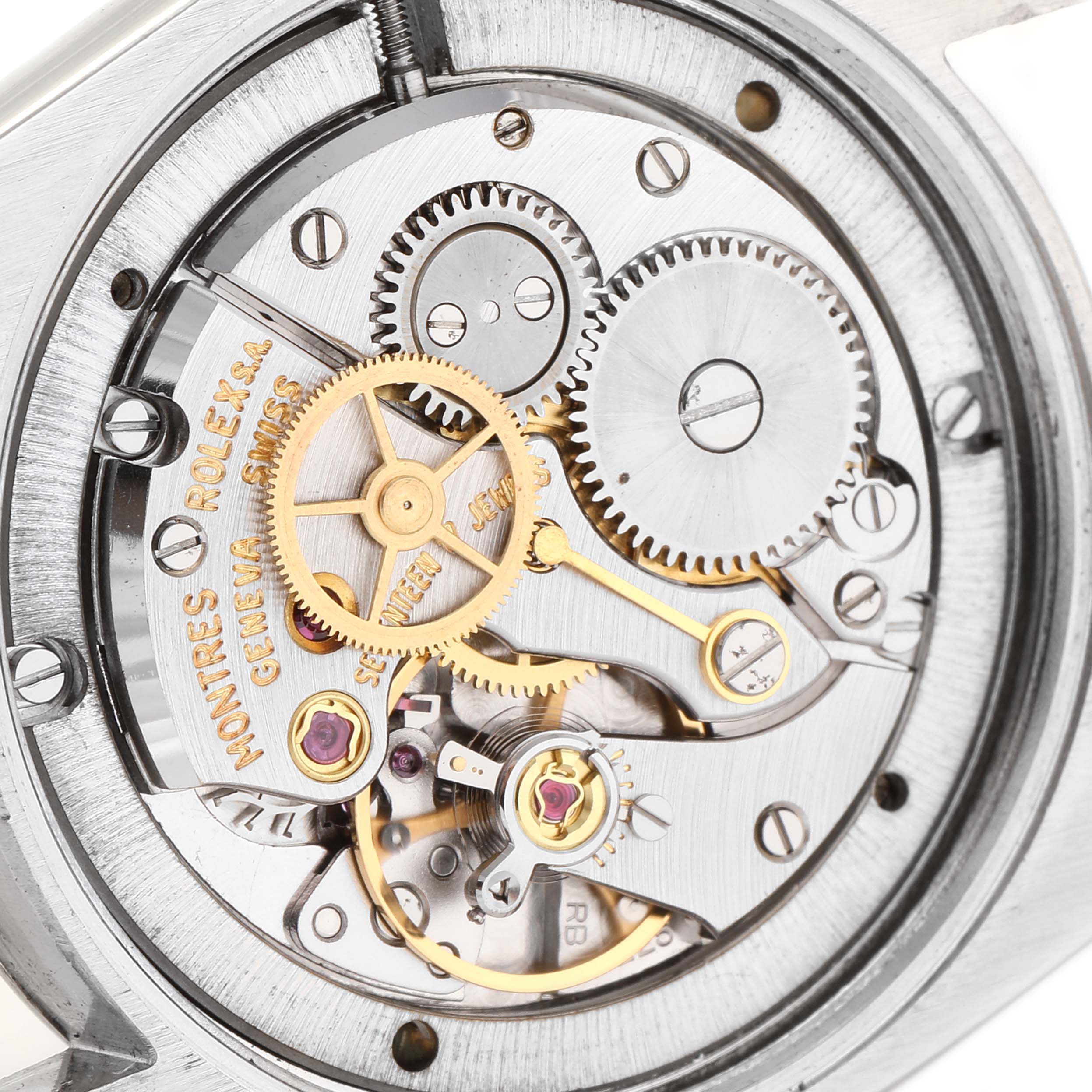 The image shows a close-up of the mechanical movement of a Rolex Vintage Collection 6694 Men's Stainless Steel Champagne Dial 6694 Men's Stainless Steel Champagne Dial watch, highlighting its gears and inner mechanisms.