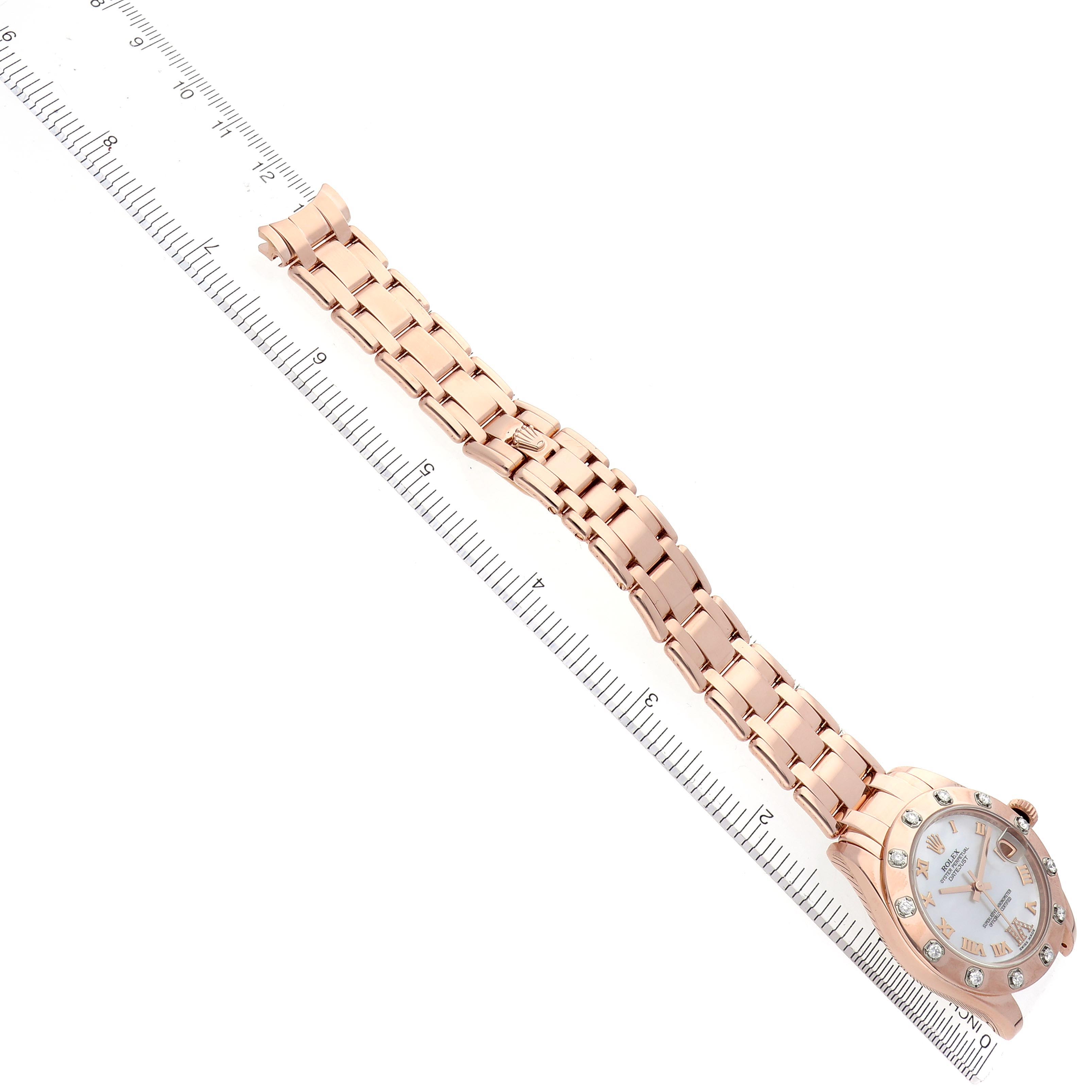 The Rolex Pearlmaster 81315 Women's Rose Gold Mother of Pearl Dial 81315 Women's Rose Gold Mother of Pearl Dial watch is displayed diagonally, showing the full band and face alongside a ruler for scale.