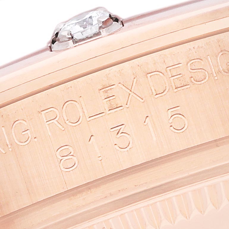 The image shows a close-up of the Rolex Pearlmaster 81315 Women's Rose Gold Mother of Pearl Dial 81315 Women's Rose Gold Mother of Pearl Dial case side, highlighting its engraved details and part of the diamond.
