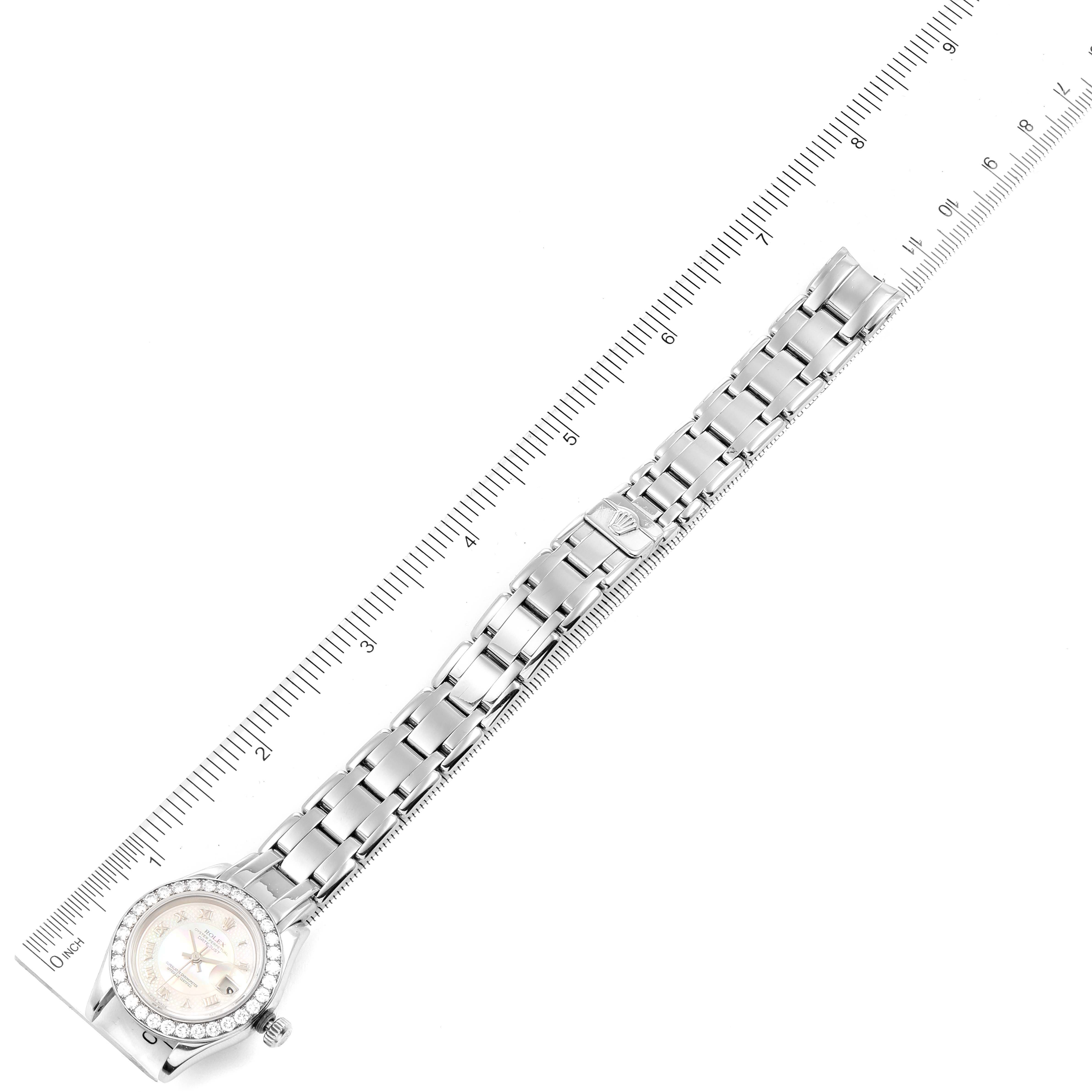 The image shows a top-down view of a Rolex Pearlmaster 80299 Women's White Gold Mother of Pearl Dial 80299 Women's White Gold Mother of Pearl Dial watch aligned with a ruler, displaying the entire bracelet and face.