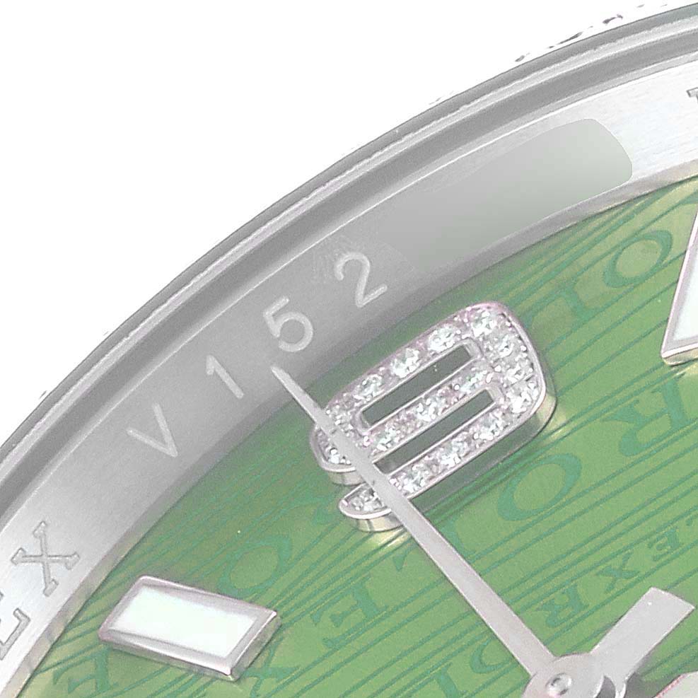 This image shows a close-up of the dial and hands of a Rolex President 116188 Men's Yellow Gold Green Dial 116188 Men's Yellow Gold Green Dial watch, with a portion of the bezel visible.