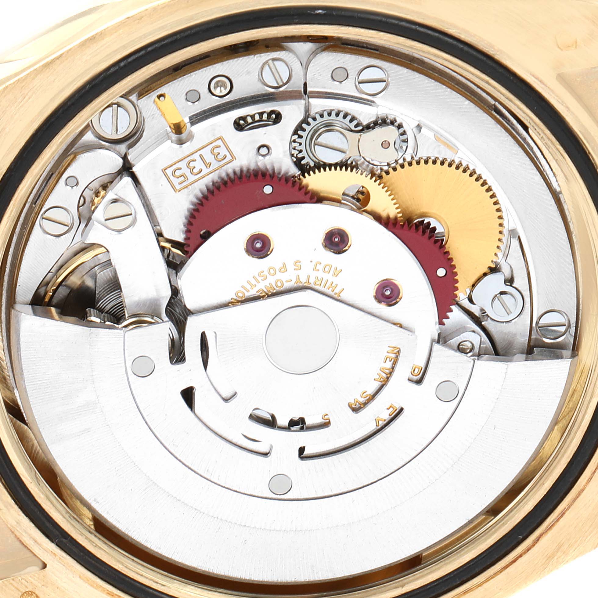 This close-up image shows the intricate internal mechanism of a President model Rolex watch, highlighting its gears and rotor.