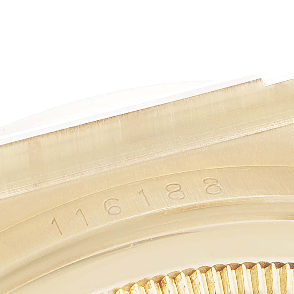The image shows a close-up of the case and rehaut with the serial number of a Rolex President 116188 Men's Yellow Gold Green Dial 116188 Men's Yellow Gold Green Dial model watch.