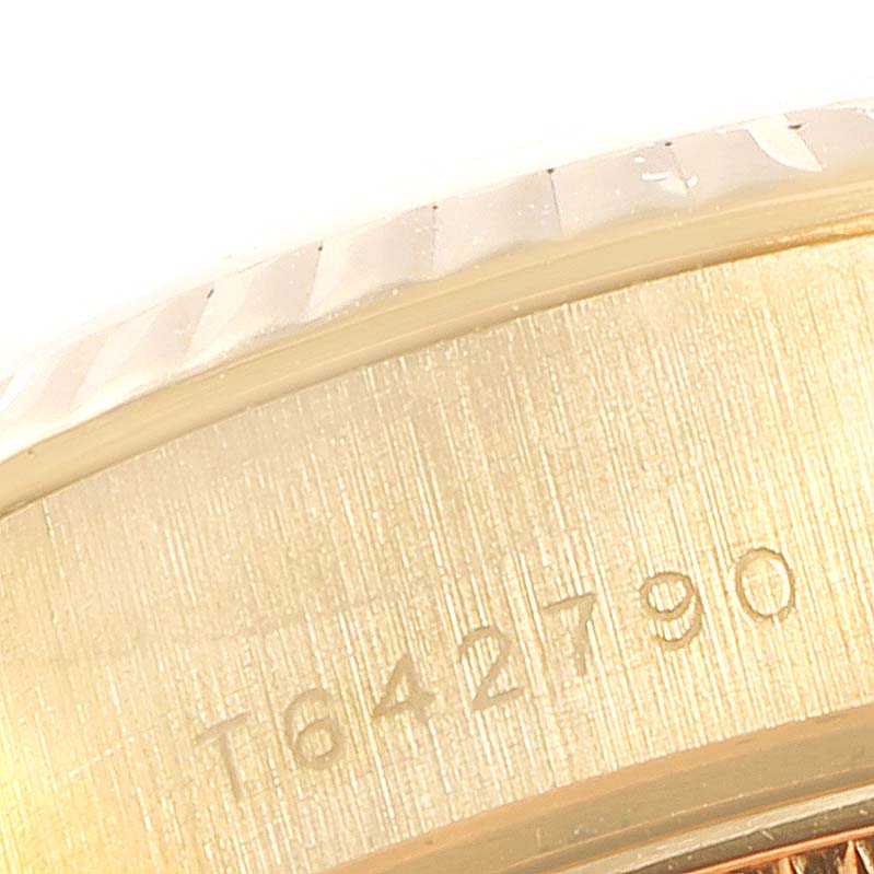 This image shows a close-up of the serial or model number engraving on the case side of a Rolex President 69178 Women
s Yellow Gold White Dial 69178 Women
s Yellow Gold White Dial watch.