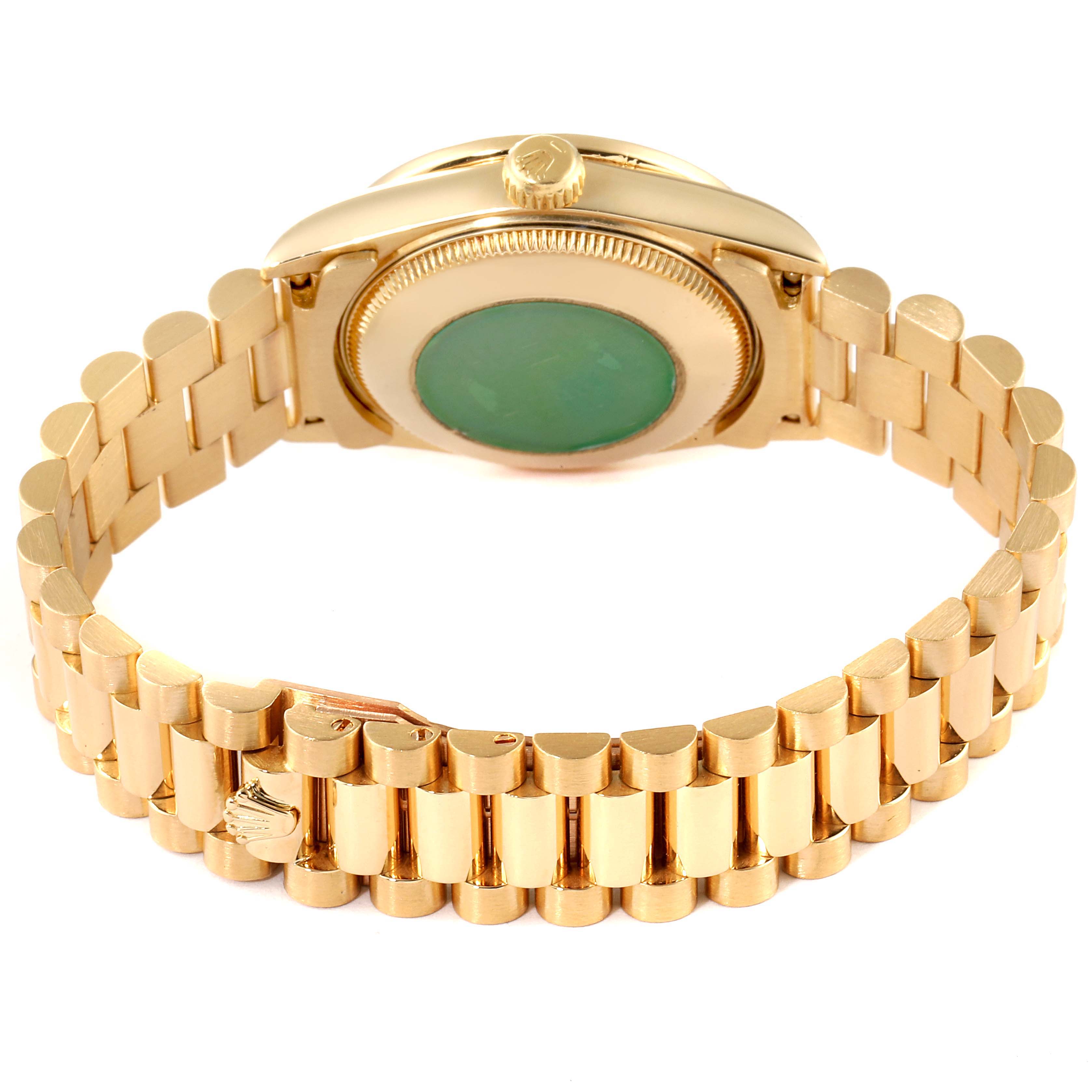 The image shows the back and bracelet of a Rolex President 68288 Women
s Yellow Gold Champagne Dial 68288 Women
s Yellow Gold Champagne Dial model watch resting on its side.