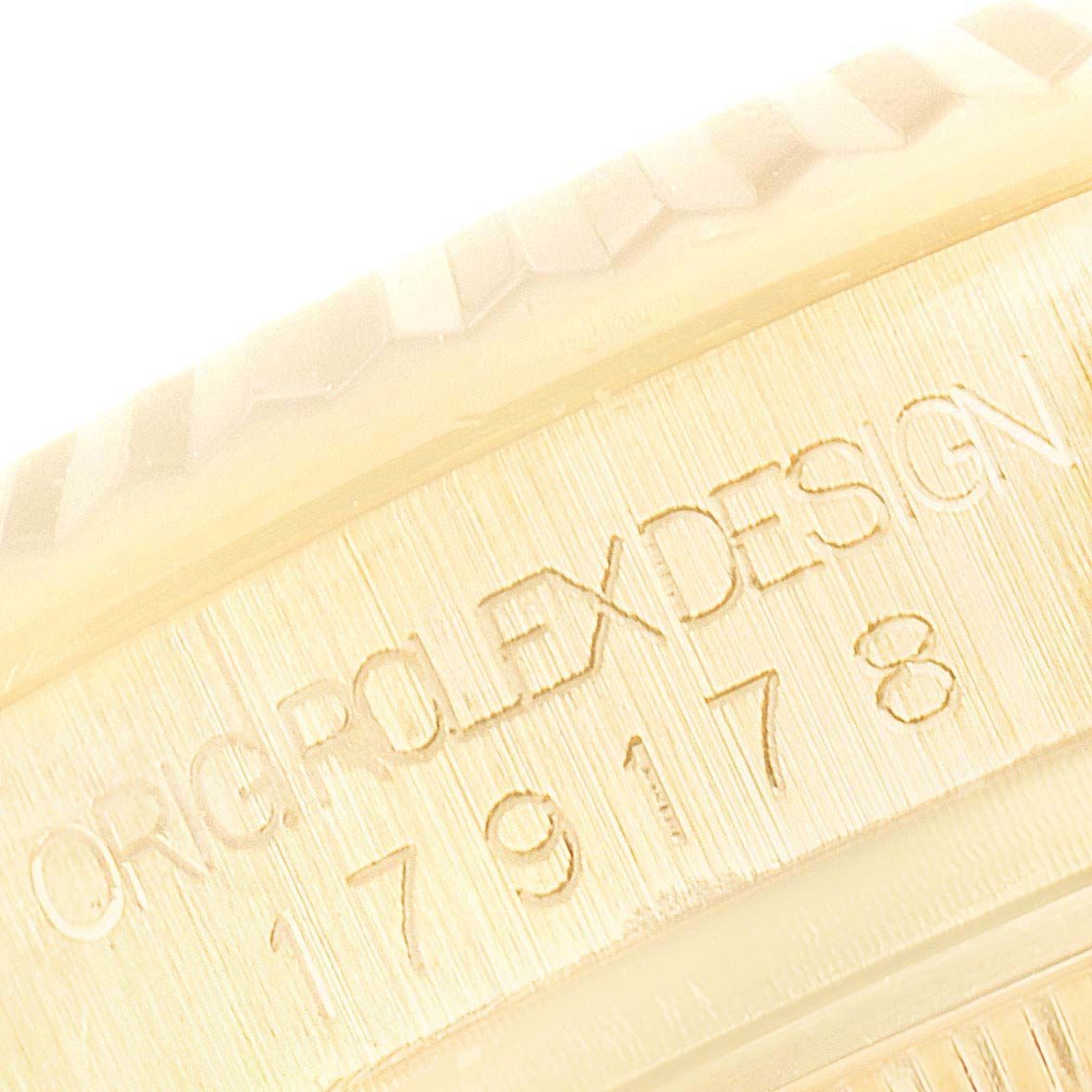 The image shows a close-up of the case with the engraved model number of the Rolex President 179178 Women's Yellow Gold Champagne Dial 179178 Women's Yellow Gold Champagne Dial watch.