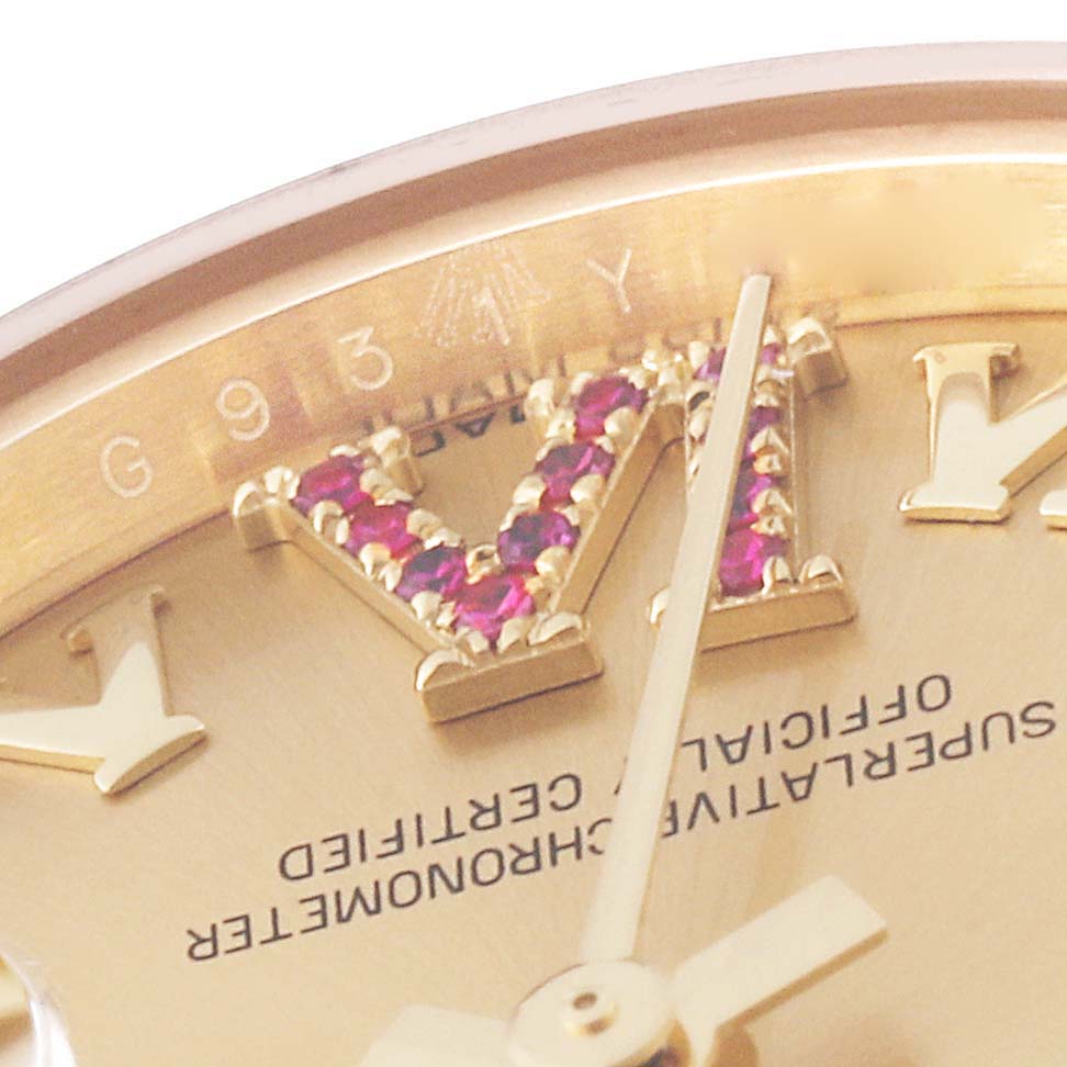 This close-up image of the Rolex President 179178 Women's Yellow Gold Champagne Dial 179178 Women's Yellow Gold Champagne Dial model watch shows part of the dial, focusing on gem-set Roman numerals and the hand.