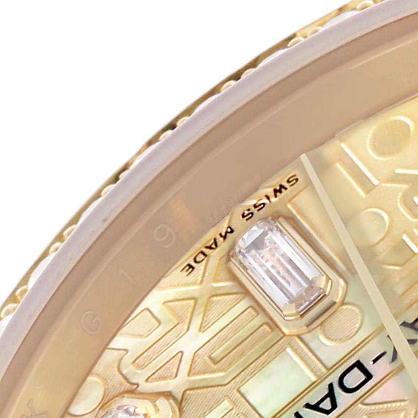 This close-up of the Rolex President 118348 Men's Yellow Gold Mother of Pearl Dial 118348 Men's Yellow Gold Mother of Pearl Dial model shows the bezel, part of the dial with gemstone markers, and partial text.
