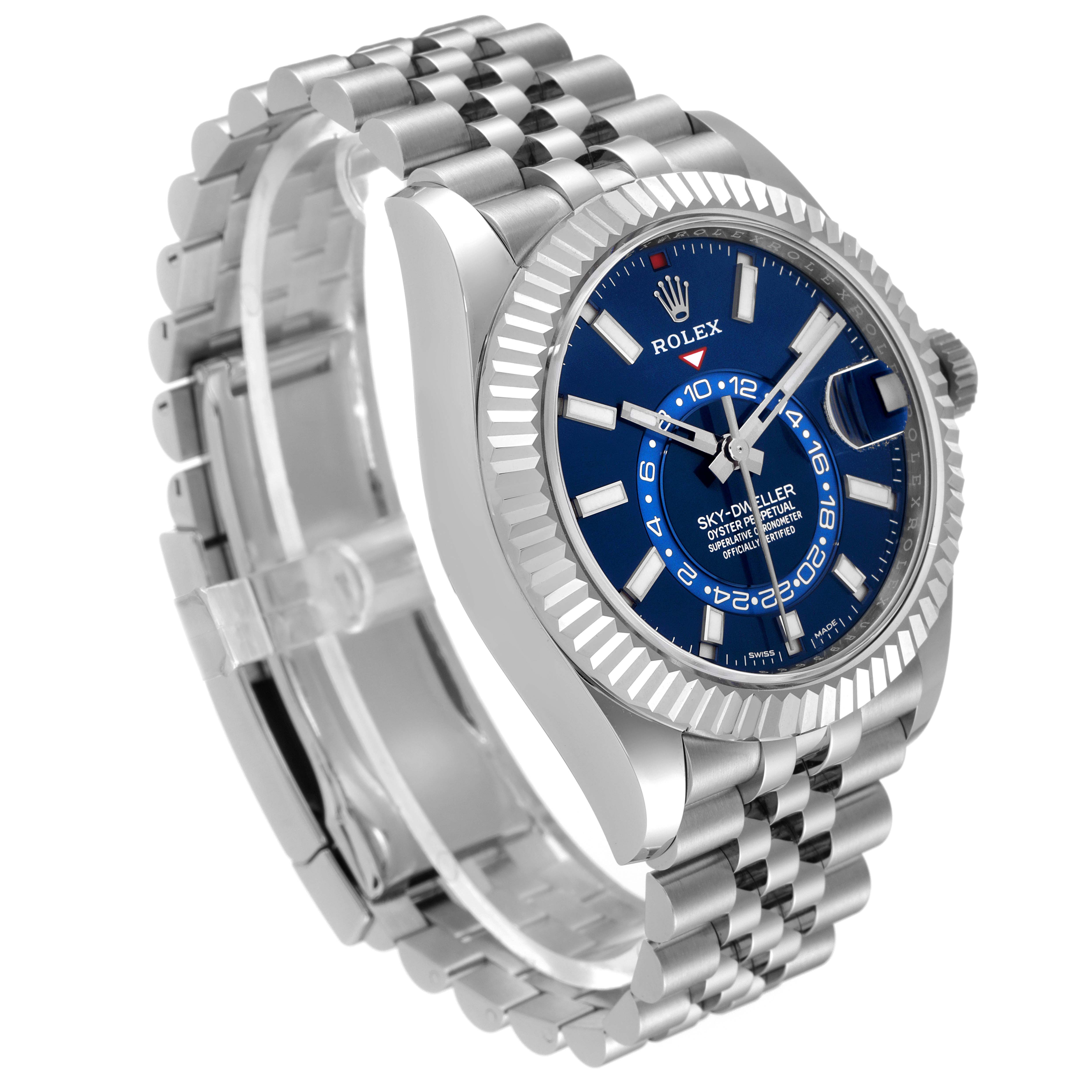 The image shows a Rolex Sky-Dweller 326934 Men's Stainless Steel Blue Dial 326934 Men's Stainless Steel Blue Dial watch angled from the right side, highlighting its blue dial, stainless steel case, and bracelet.