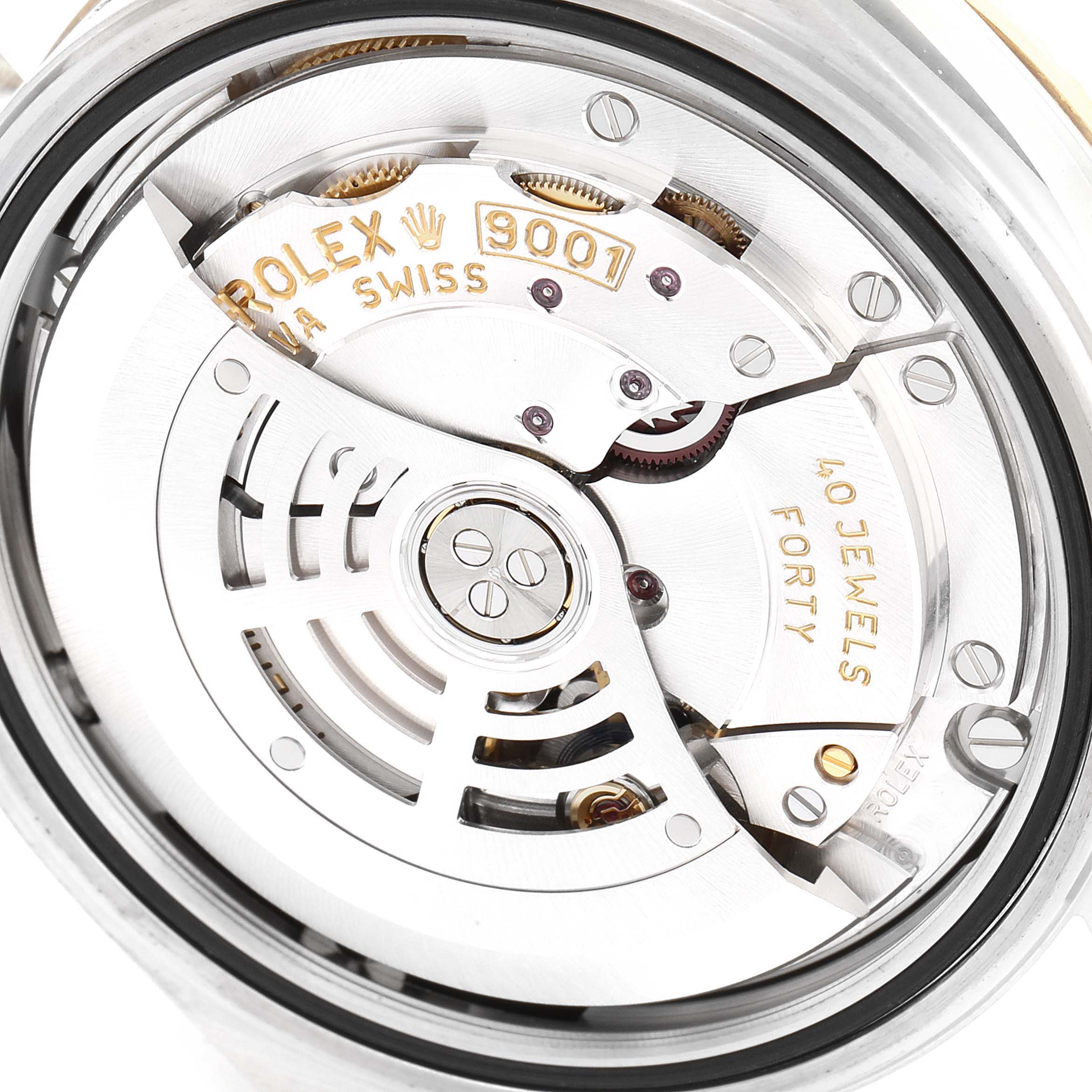 This image shows the internal mechanism of a Rolex Sky-Dweller 326933 Men's Steel and Gold (two tone) Champagne Dial 326933 Men's Steel and Gold (two tone) Champagne Dial watch, featuring its 9001 movement and intricate components.