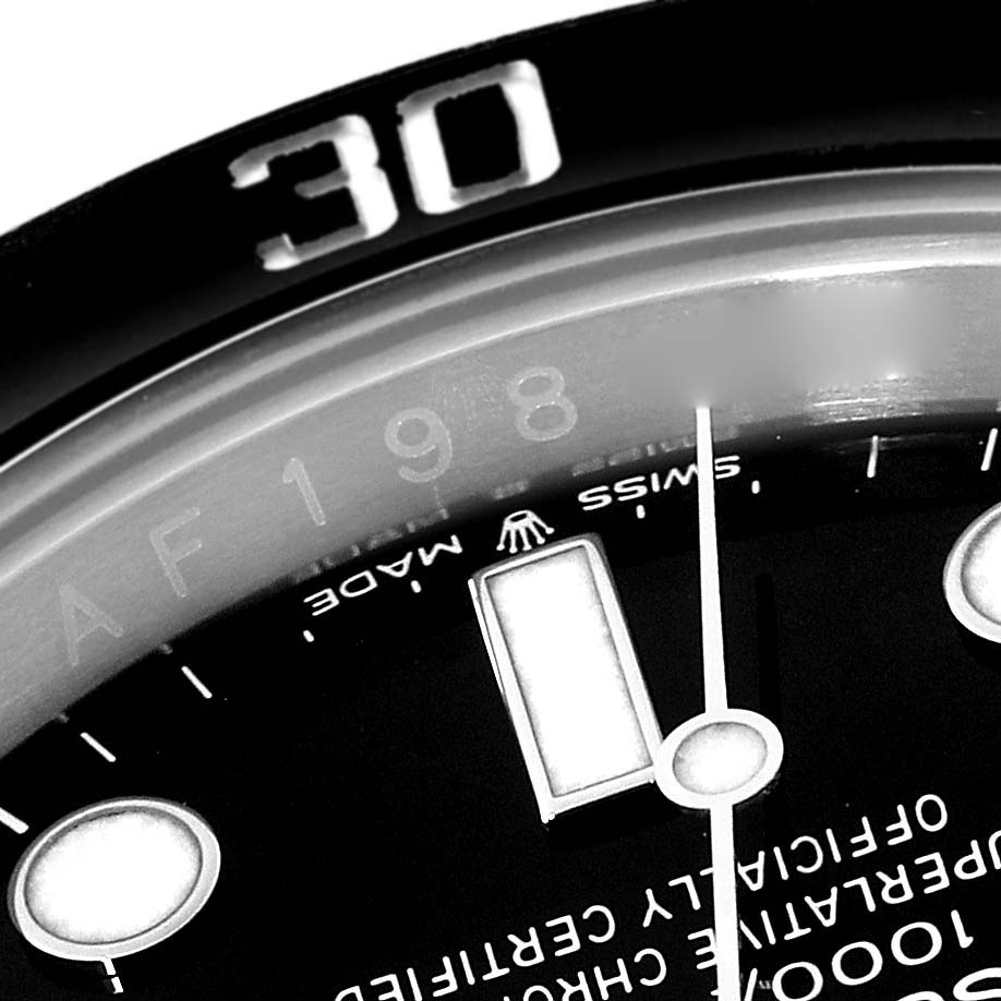 The image shows a close-up of the dial and bezel of a Rolex Submariner 126610LN Men
s Stainless Steel Black Dial 126610LN Men
s Stainless Steel Black Dial watch, highlighting the "30" marker on the bezel and part of the dial
s text and markers.