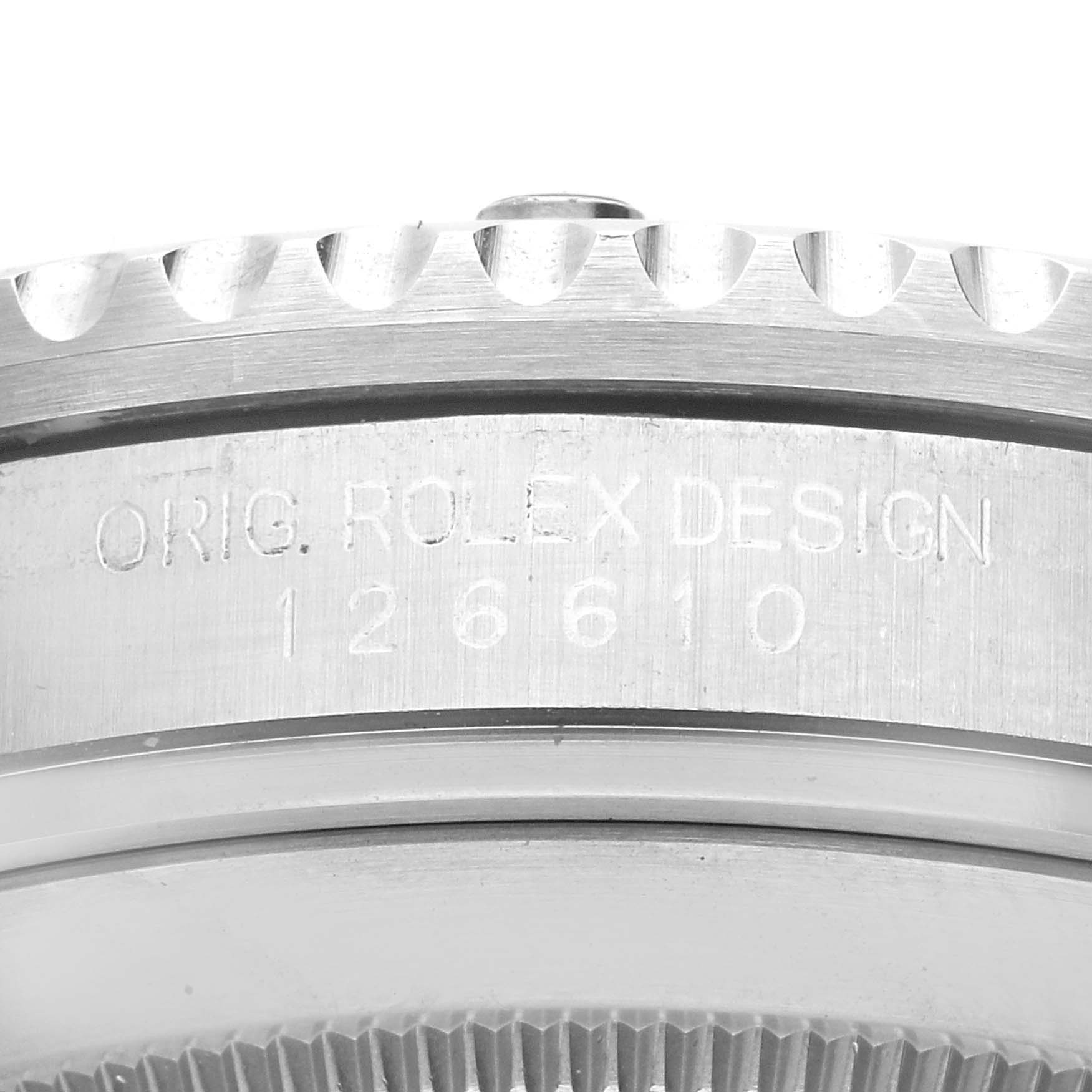 This close-up image shows the engraved model number and the bezel
s edge of a Rolex Submariner 126610LN Men
s Stainless Steel Black Dial 126610LN Men
s Stainless Steel Black Dial watch.