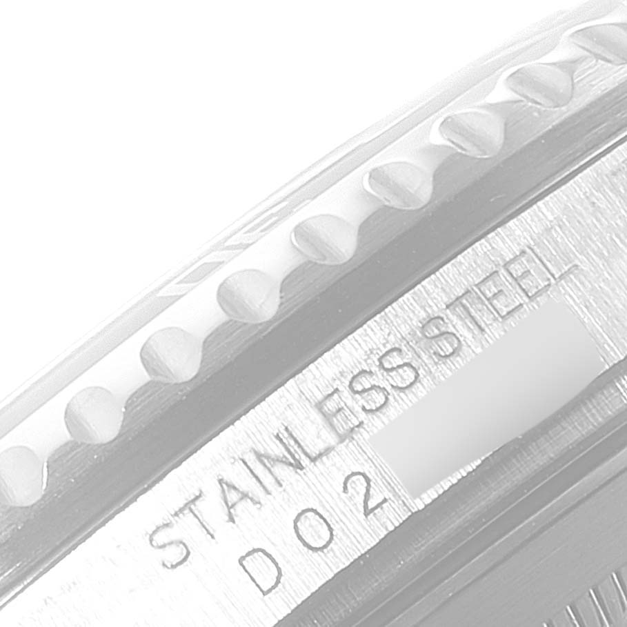 This close-up image shows the side of the bezel and case with part of the serial number of a Rolex Submariner 16610 Men
s Stainless Steel Black Dial 16610 Men
s Stainless Steel Black Dial watch.