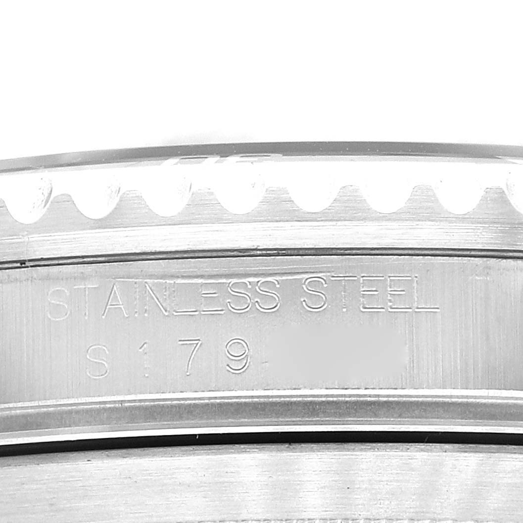 This image shows a close-up of the engraving on the stainless steel case of a Rolex Submariner 16610 Men
s Stainless Steel Black Dial 16610 Men
s Stainless Steel Black Dial watch.
