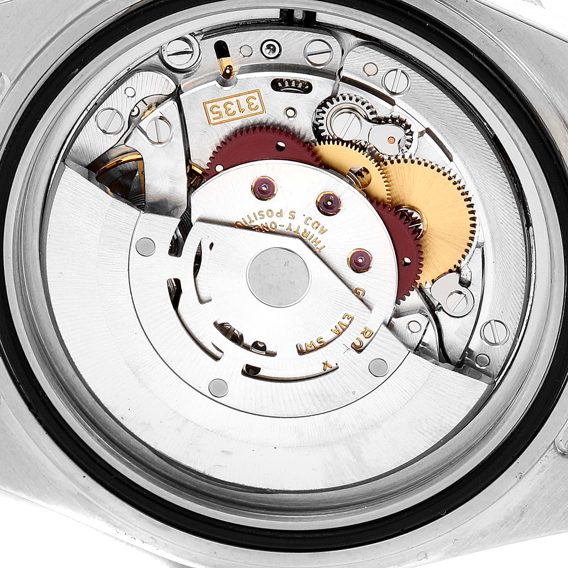 This image shows the internal mechanism of a Rolex Submariner 16613 Men's Steel and Gold (two tone) Champagne Dial 16613 Men's Steel and Gold (two tone) Champagne Dial watch from a back case angle, highlighting its gears and movement.