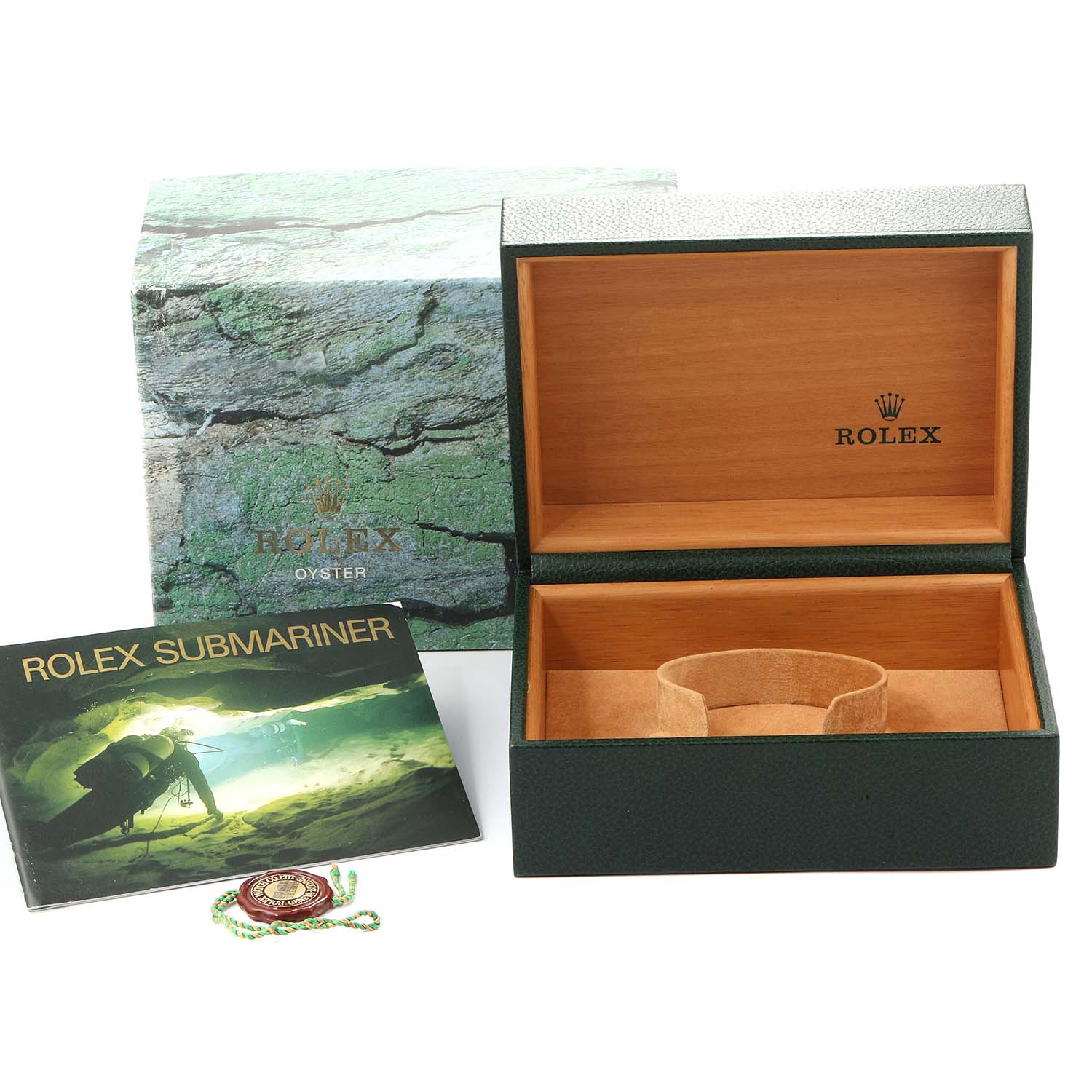 The image shows a Rolex Submariner 16803 Men
s Stainless Steel Grey Dial 16803 Men
s Stainless Steel Grey Dial packaging box, a booklet, and a green seal tag.