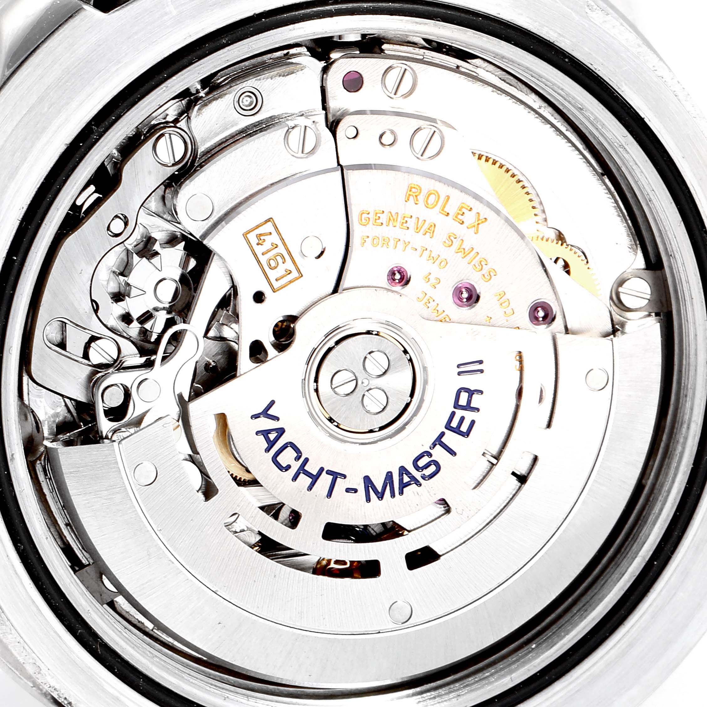 The image shows the intricate internal mechanical movement of a Rolex Yacht-Master 116680 Men
s Stainless Steel White Dial 116680 Men
s Stainless Steel White Dial II watch.