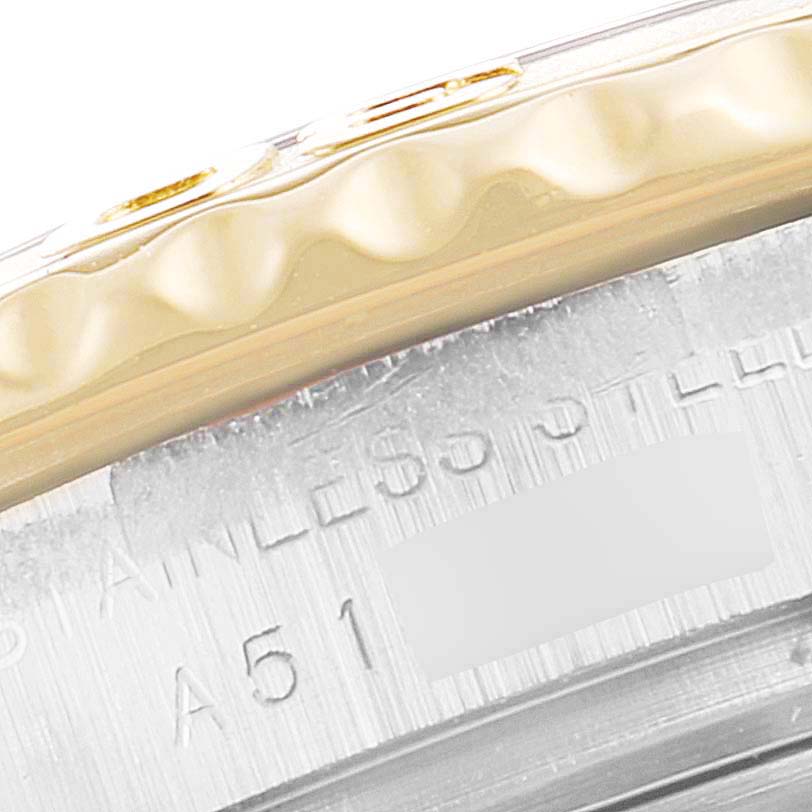 A close-up of a Rolex Yacht-Master 169623 Women's Steel and Gold (two tone) White Dial 169623 Women's Steel and Gold (two tone) White Dial watch showing part of its bezel and engraved stainless steel case.