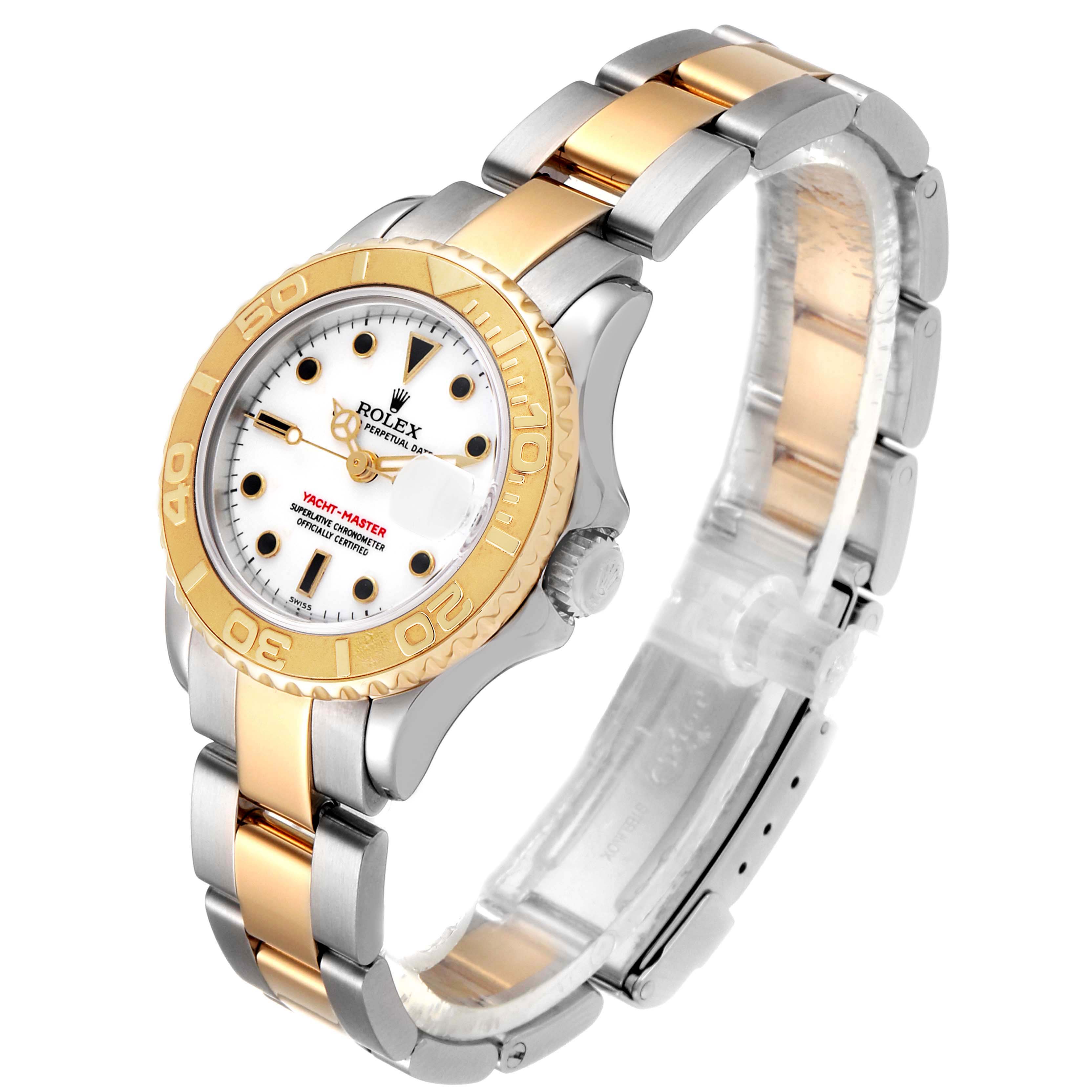 The image shows a Rolex Yacht-Master 169623 Women's Steel and Gold (two tone) White Dial 169623 Women's Steel and Gold (two tone) White Dial watch at an angled view, highlighting its two-tone bracelet, bezel, and dial.