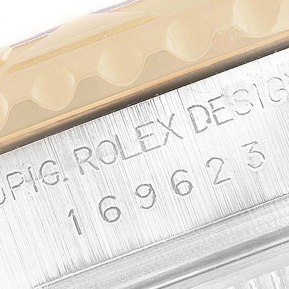 This image shows a close-up of the bezel and engraved side of a Rolex Yacht-Master 169623 Women's Steel and Gold (two tone) White Dial 169623 Women's Steel and Gold (two tone) White Dial watch.