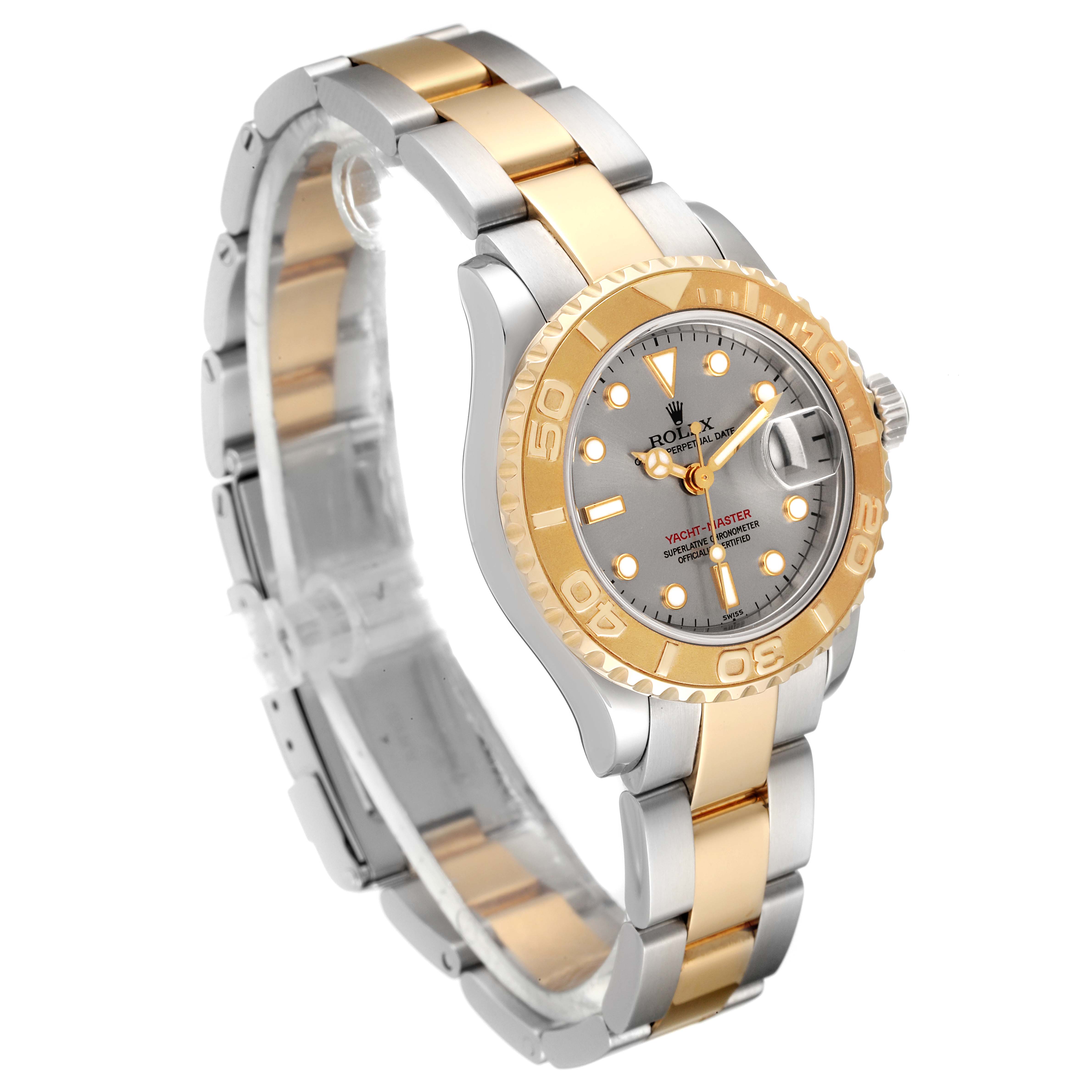 This Rolex Yacht-Master 69623 Women's Steel and Gold (two tone) Grey Dial 69623 Women's Steel and Gold (two tone) Grey Dial watch is shown in a three-quarter angle, displaying the dial, bezel, and bi-metal bracelet.