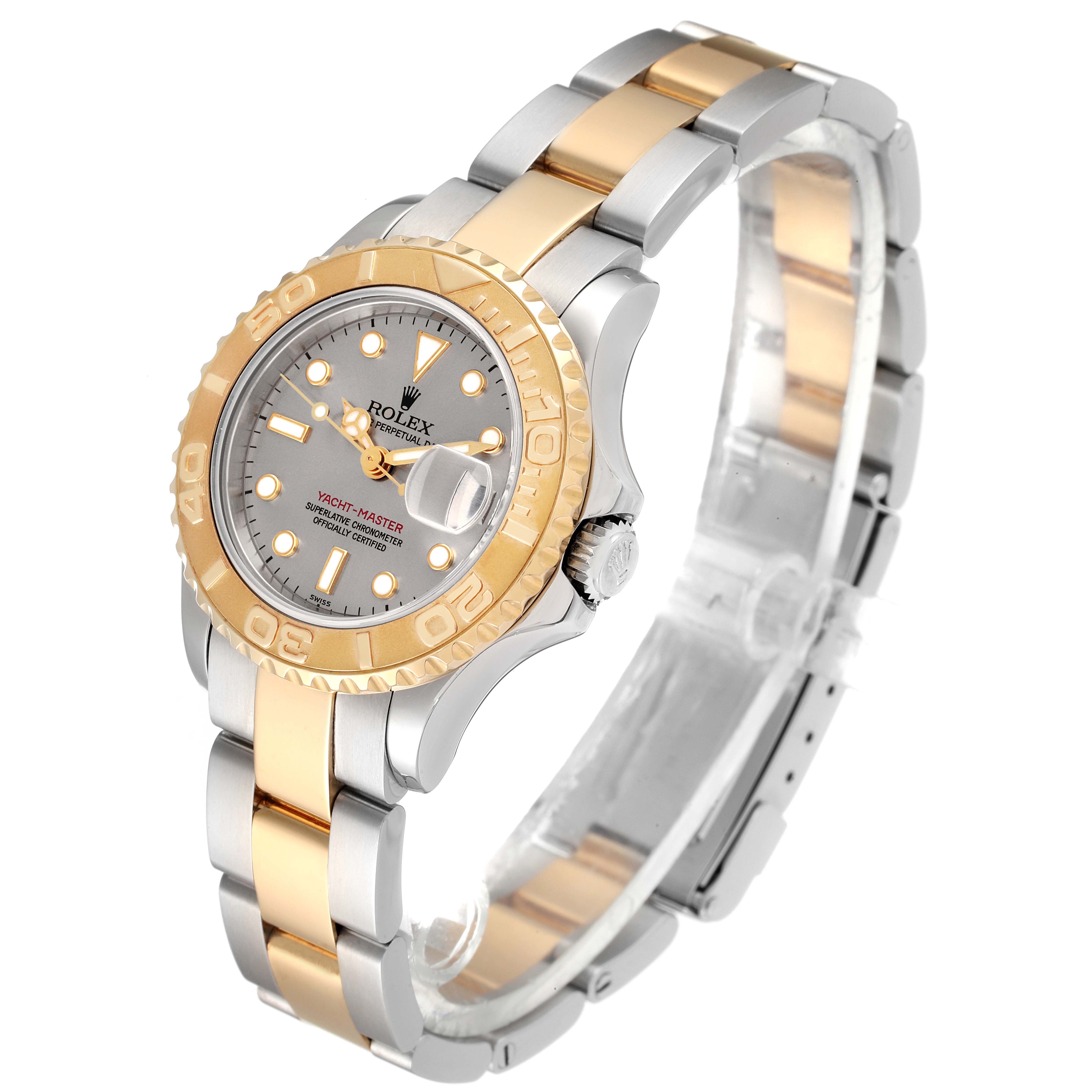 The image shows the Rolex Yacht-Master 69623 Women's Steel and Gold (two tone) Grey Dial 69623 Women's Steel and Gold (two tone) Grey Dial watch at a slight side angle, highlighting its bezel, dial, hands, crown, and two-tone bracelet.