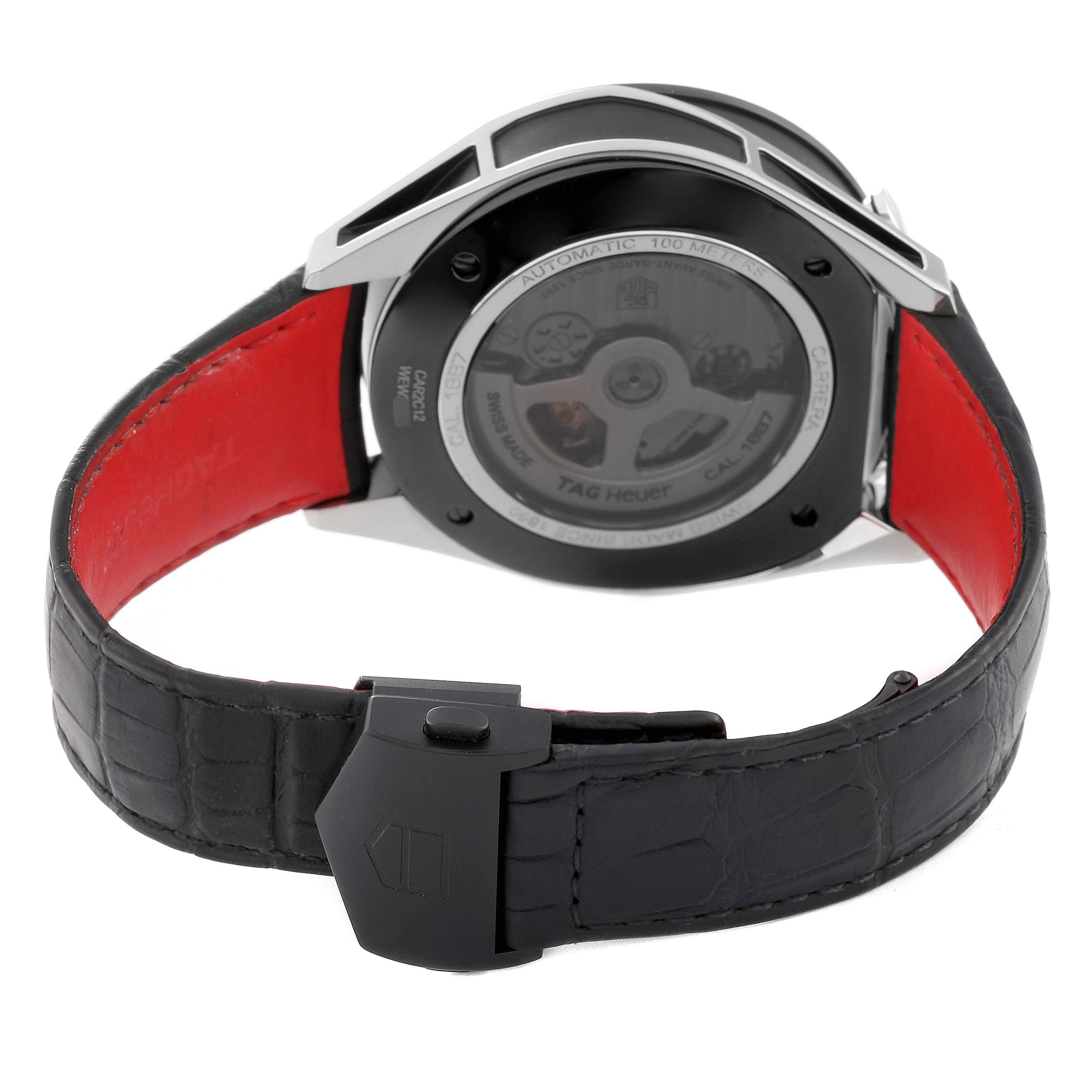 The image shows the back of the Tag Heuer Carrera CAR2C12.FC6327 Men's Stainless Steel Grey Dial watch, highlighting the transparent case back and black leather strap with a red interior.