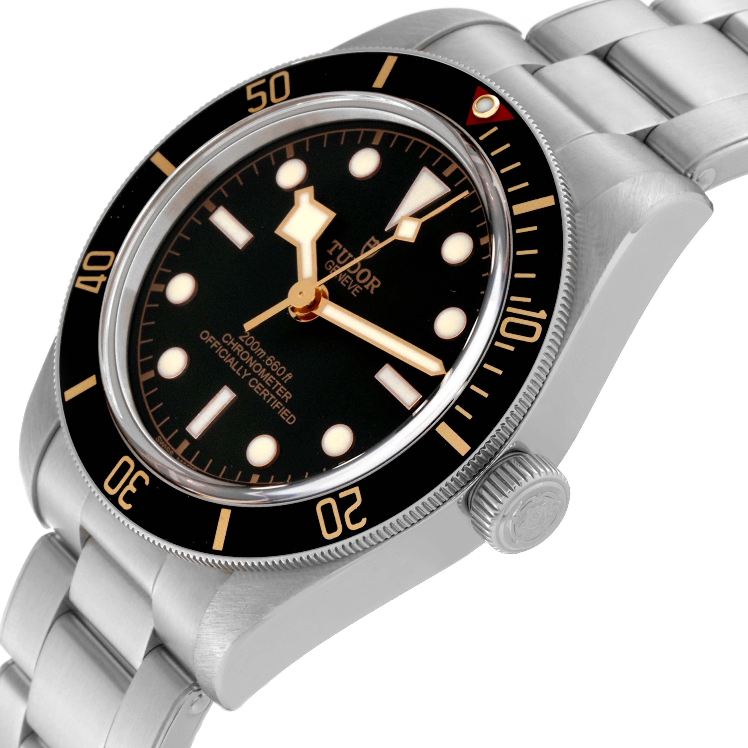 The Tudor Heritage Black Bay 79030N Men's Stainless Steel Black Dial 79030N Men's Stainless Steel Black Dial watch is shown at a slight angle, displaying its face, bezel, bracelet, and crown.
